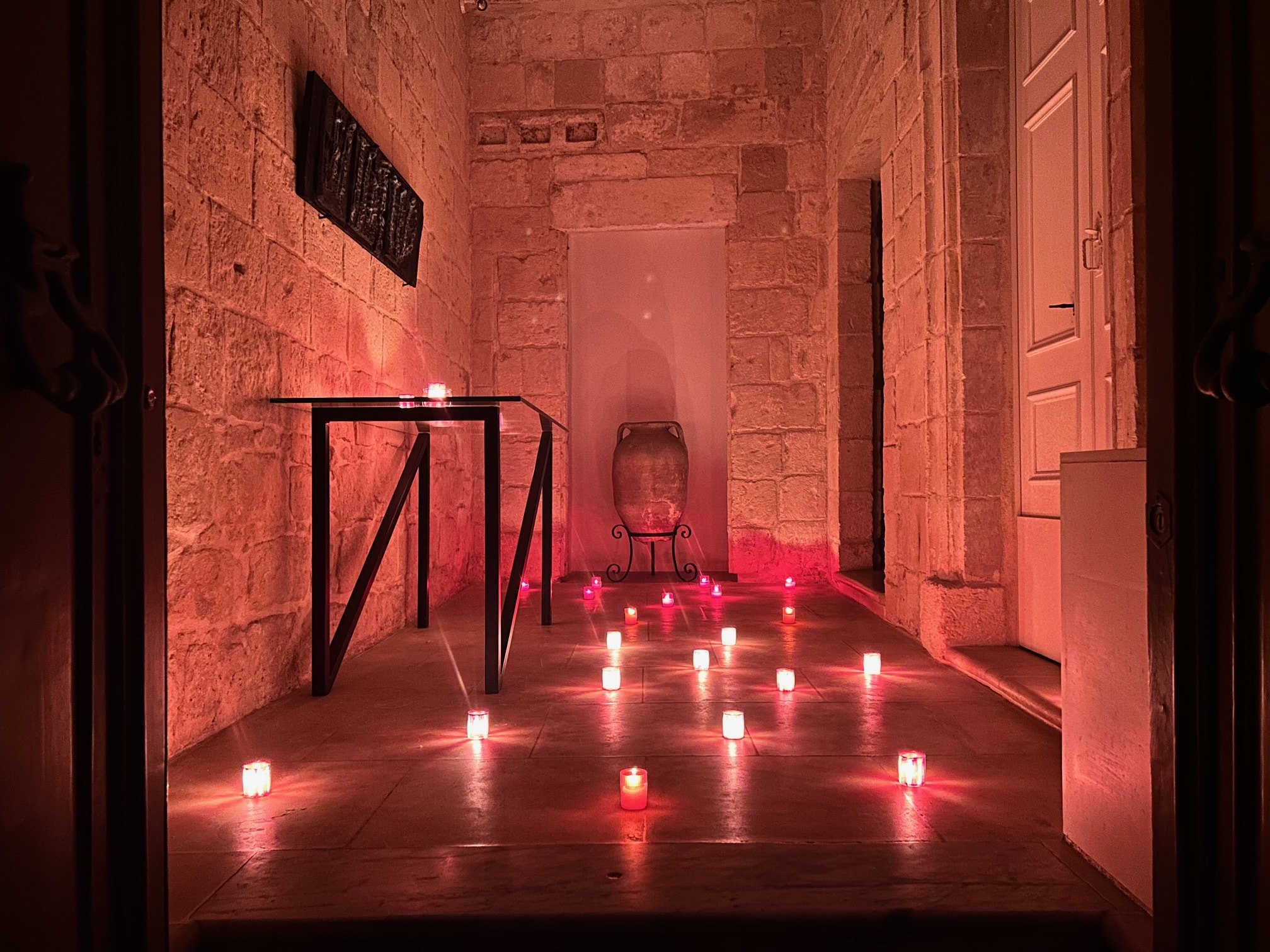 Traditional Birgu townhouse entrance decorated with candles during the Birgu by Candlelight festival.