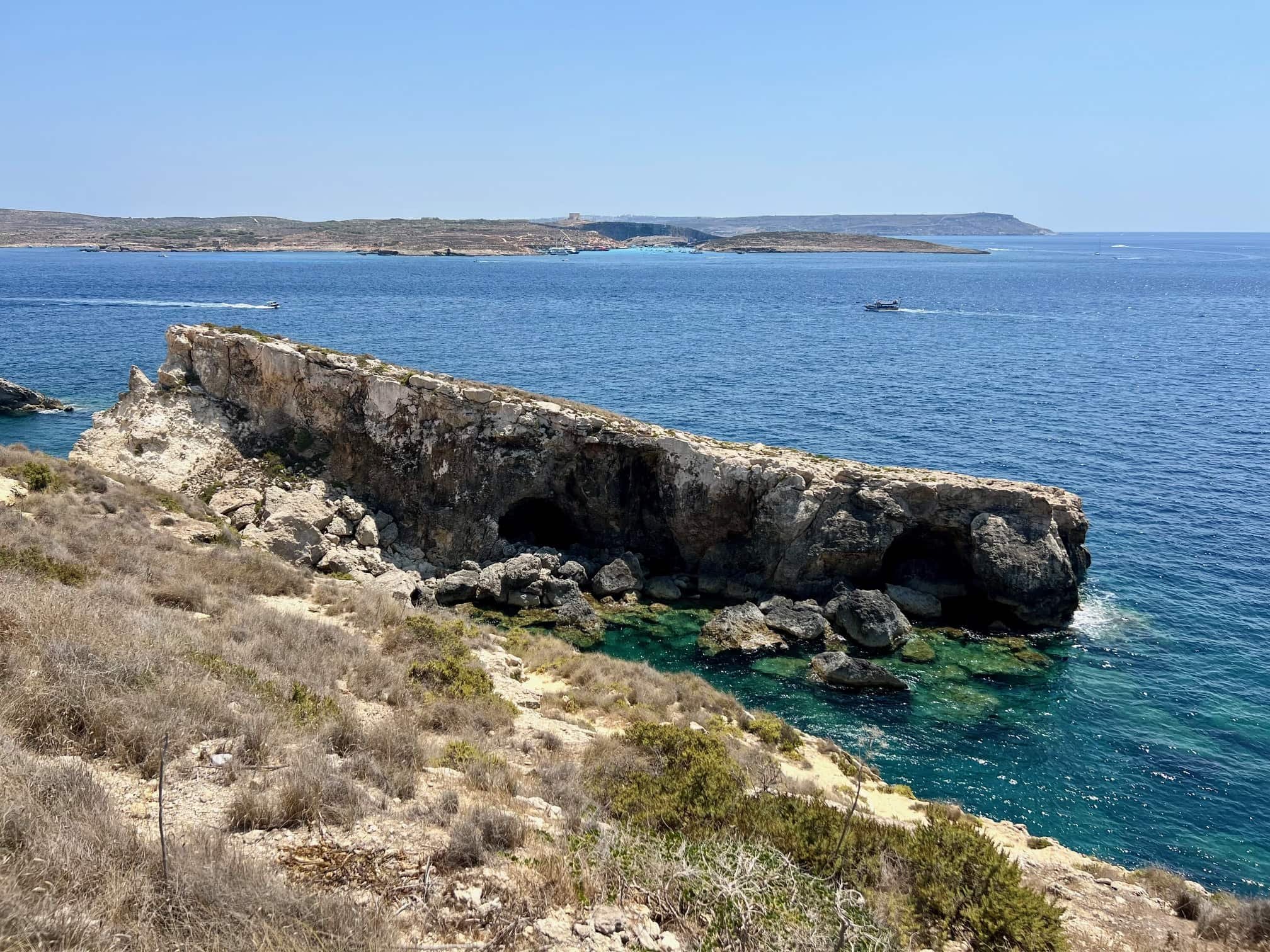 The hidden inlet of Ta’ Bamberin in Gozo with crystal clear turquoise water, perfect for snorkeling.