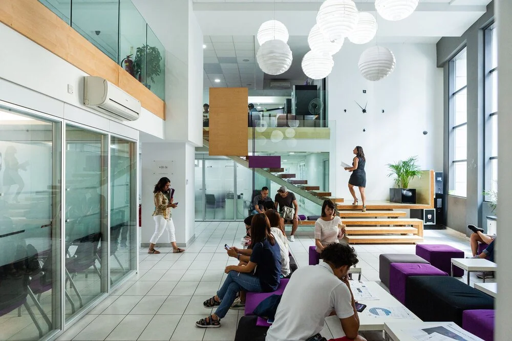 The modern, bright reception area and lobby of ACE English language school inside Bay Street Complex, St. Julian's.