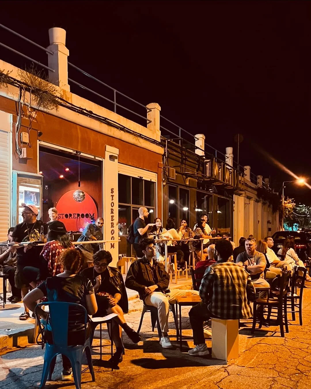 The Storeroom music venue in Ta' Xbiex with red lighting, built into a former boathouse.