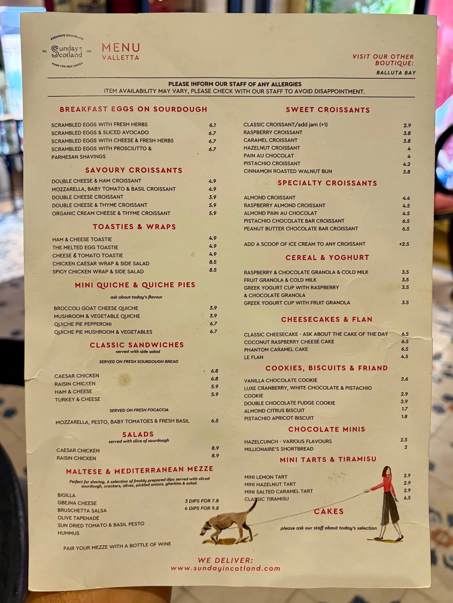 Printed food menu listing breakfast dishes and croissants at Sunday in Scotland, Valletta.