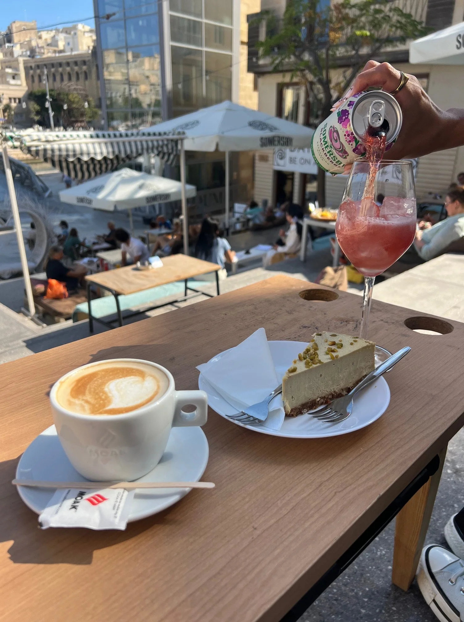 Cappuccino and pistachio cake at DATE Art Café in the Three Cities.