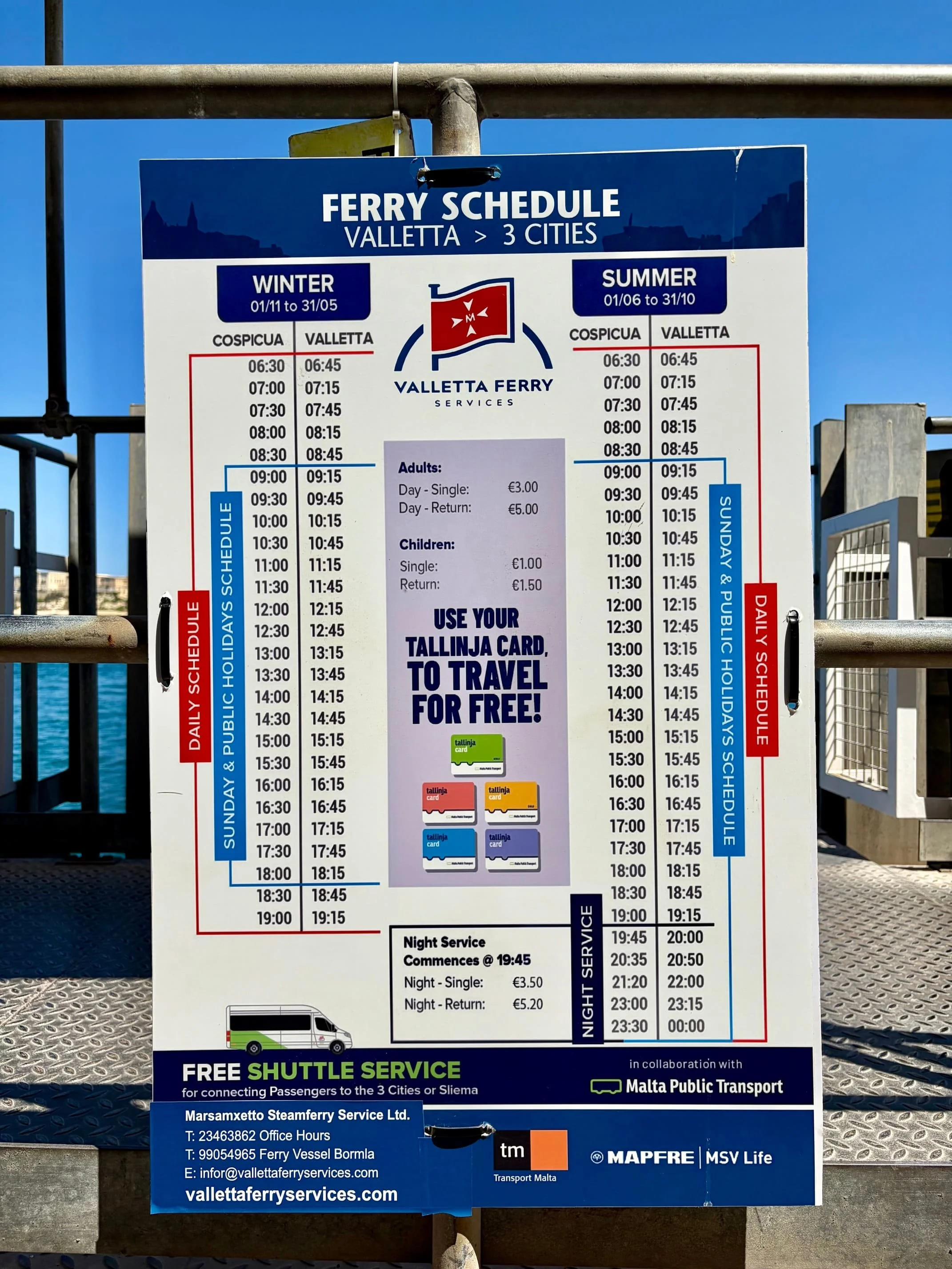 Official Valletta Ferry Services schedule board showing departure times between Valletta and the Three Cities (Cospicua).
