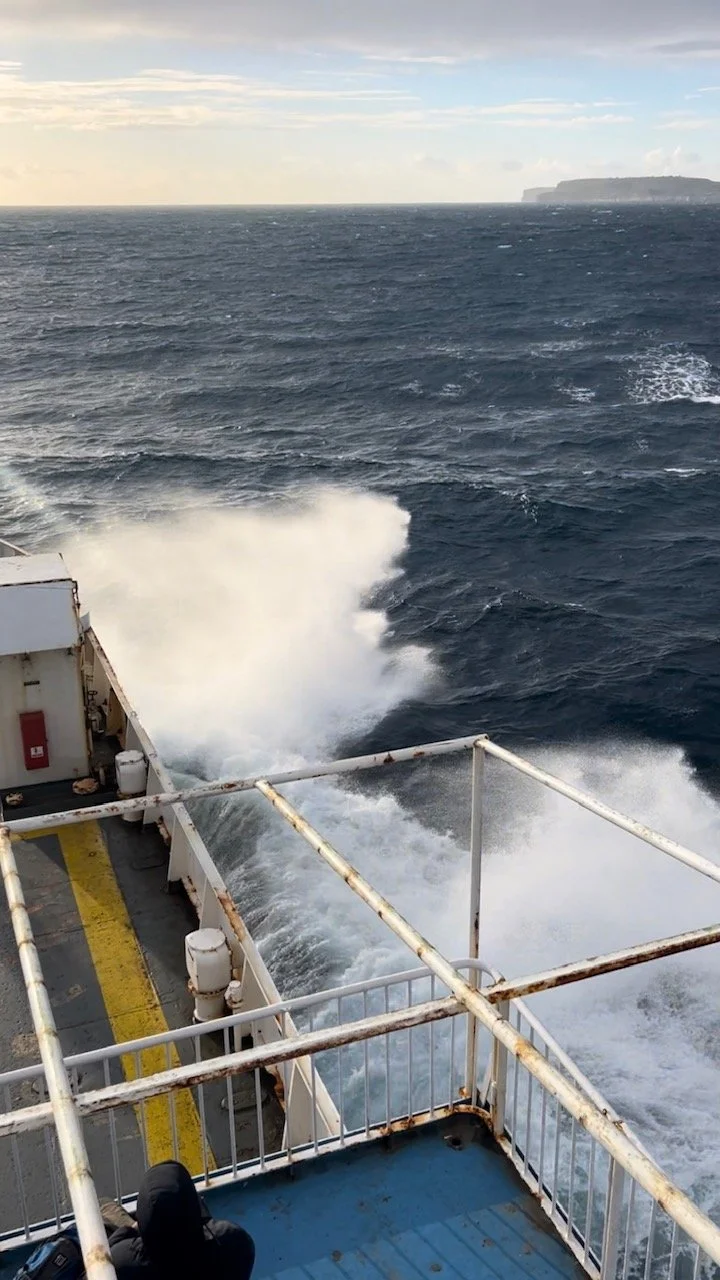 Screenshot from a video taken from the upper deck of Gozo Channel Line with waves hitting the ferry.