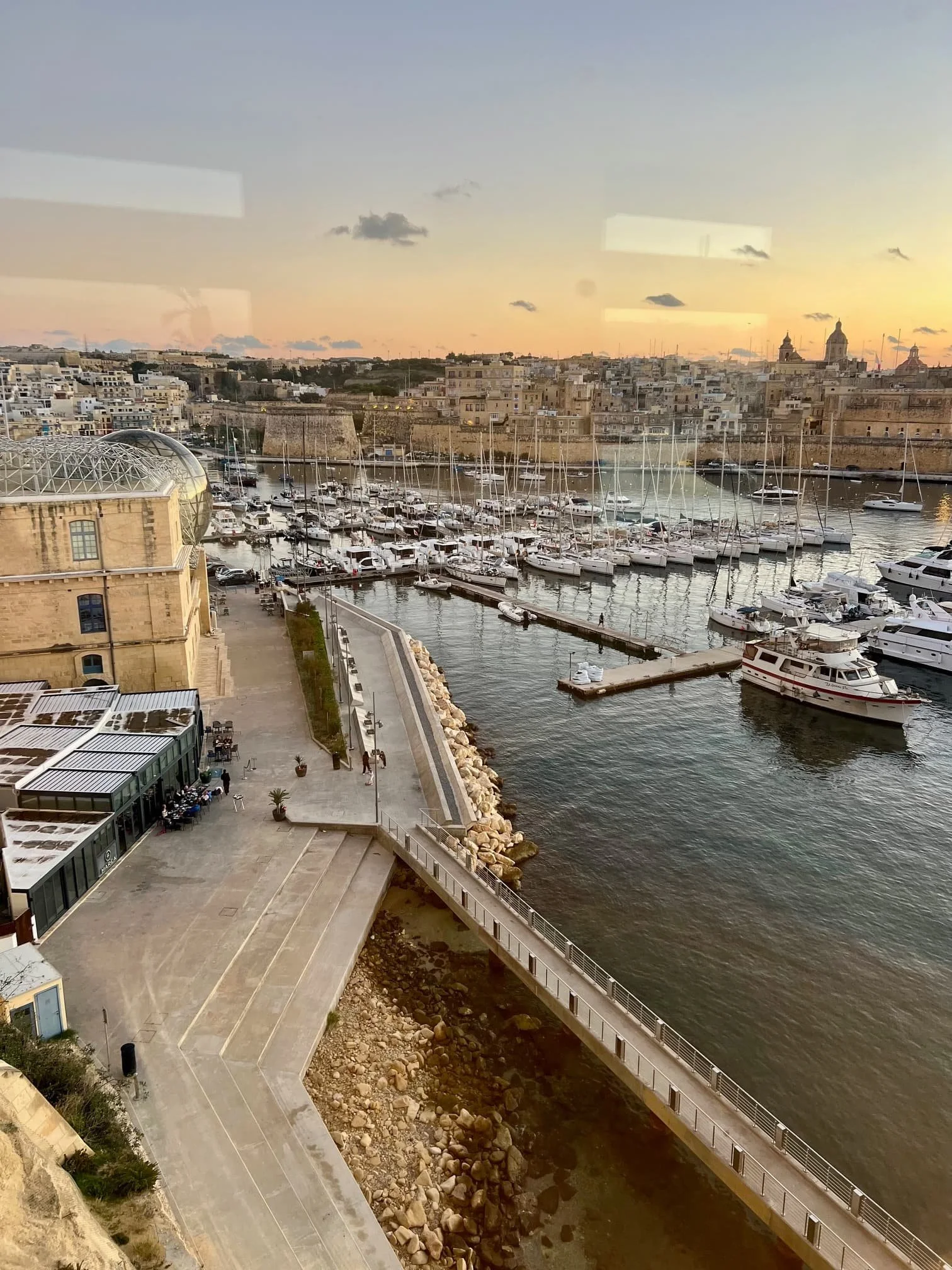 Panoramic view towards Kalkara, the marina and historic surroundings from the upper Bighi lift.
