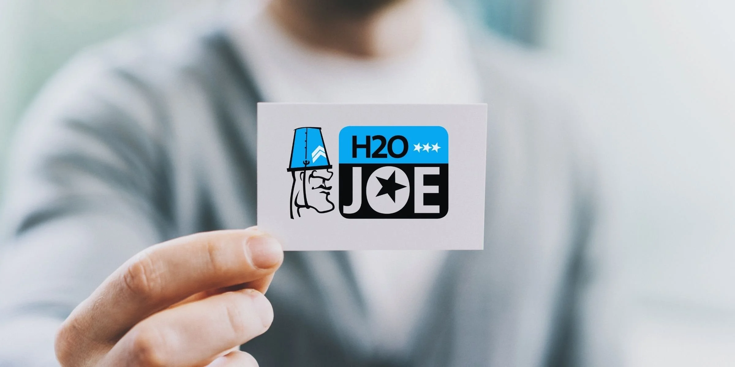 Hand holding custom designed business card