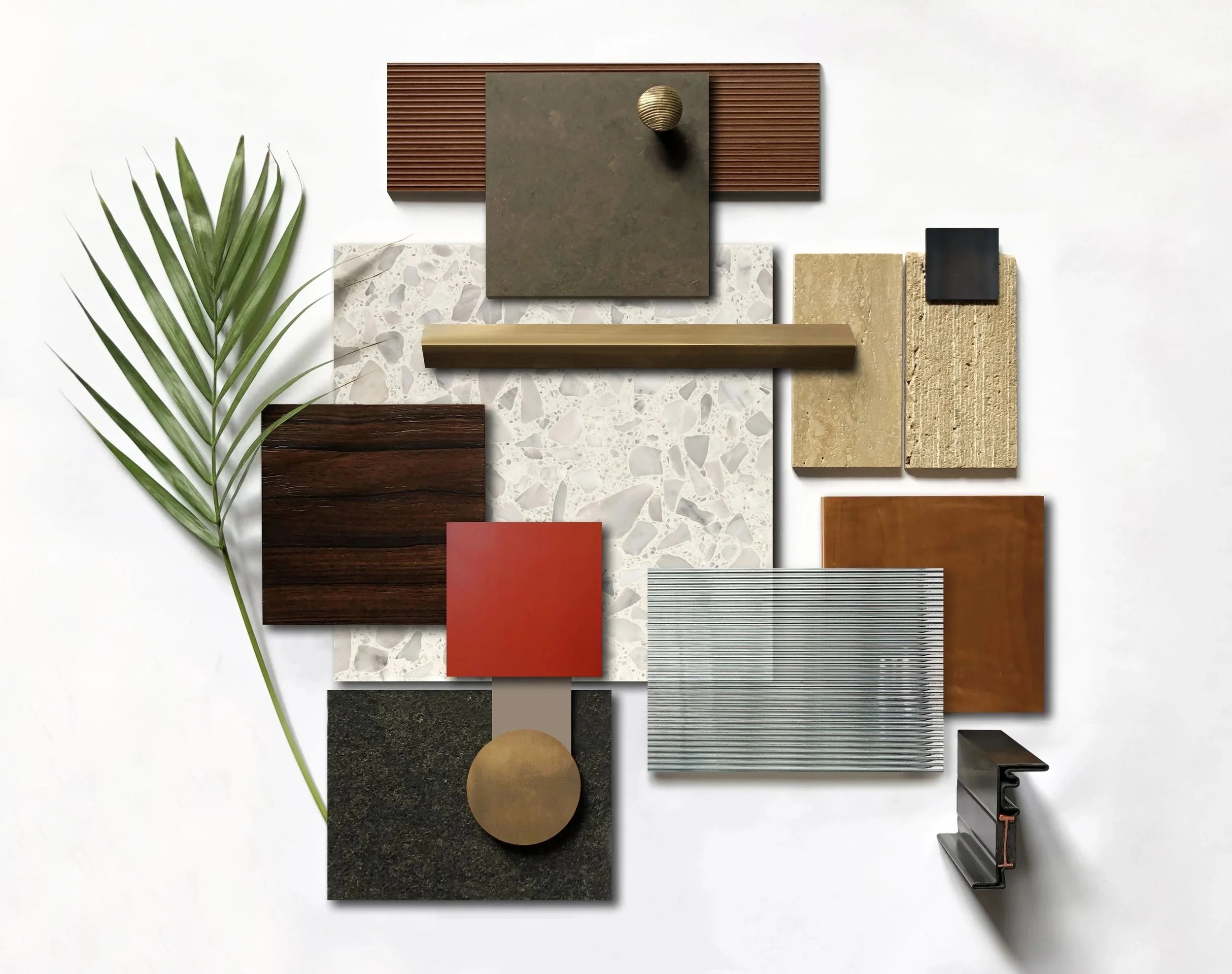 Arrangement of various material and texture samples including wood, stone, metal, fabric, and a green palm leaf on a white background.
