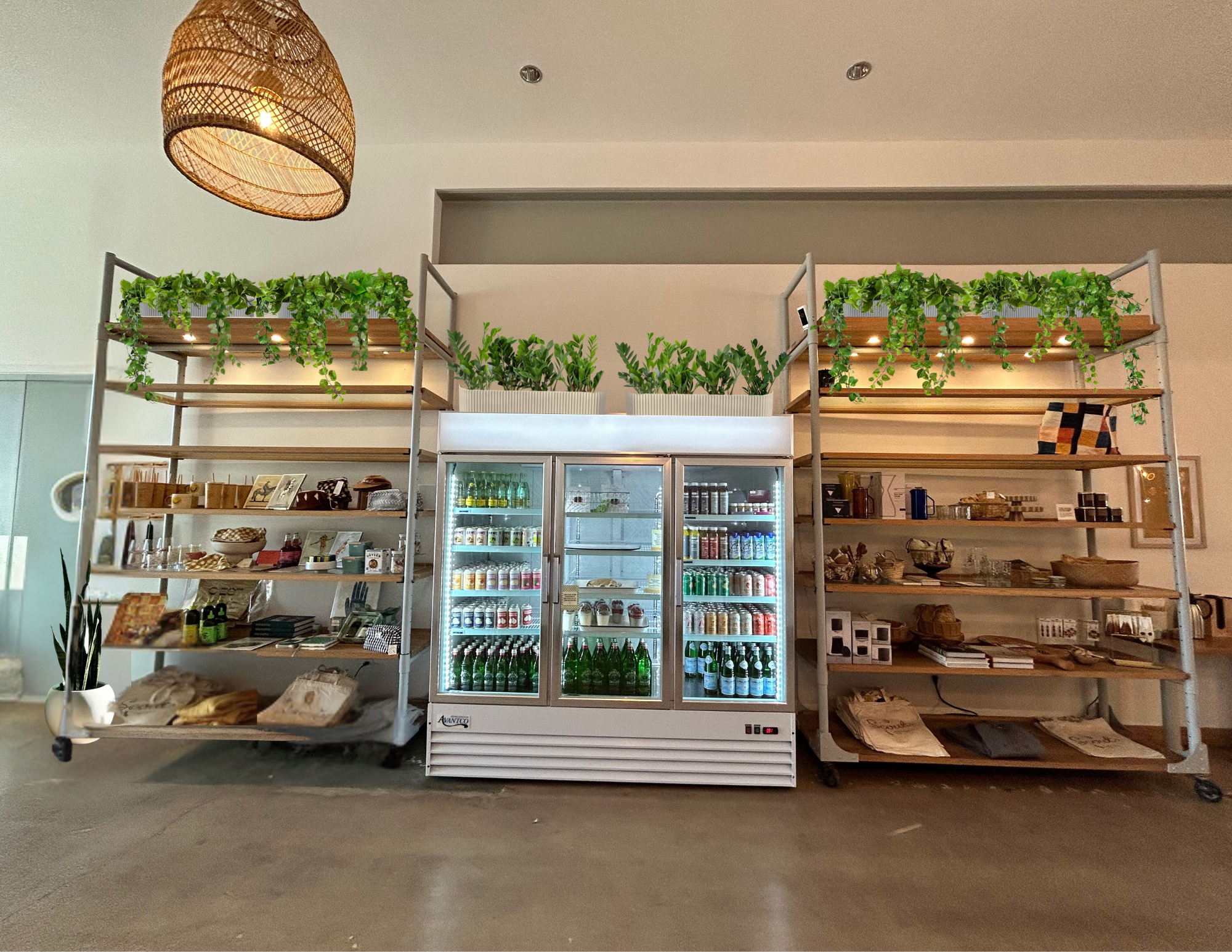 Store display with shelving, beverage cooler, and plants