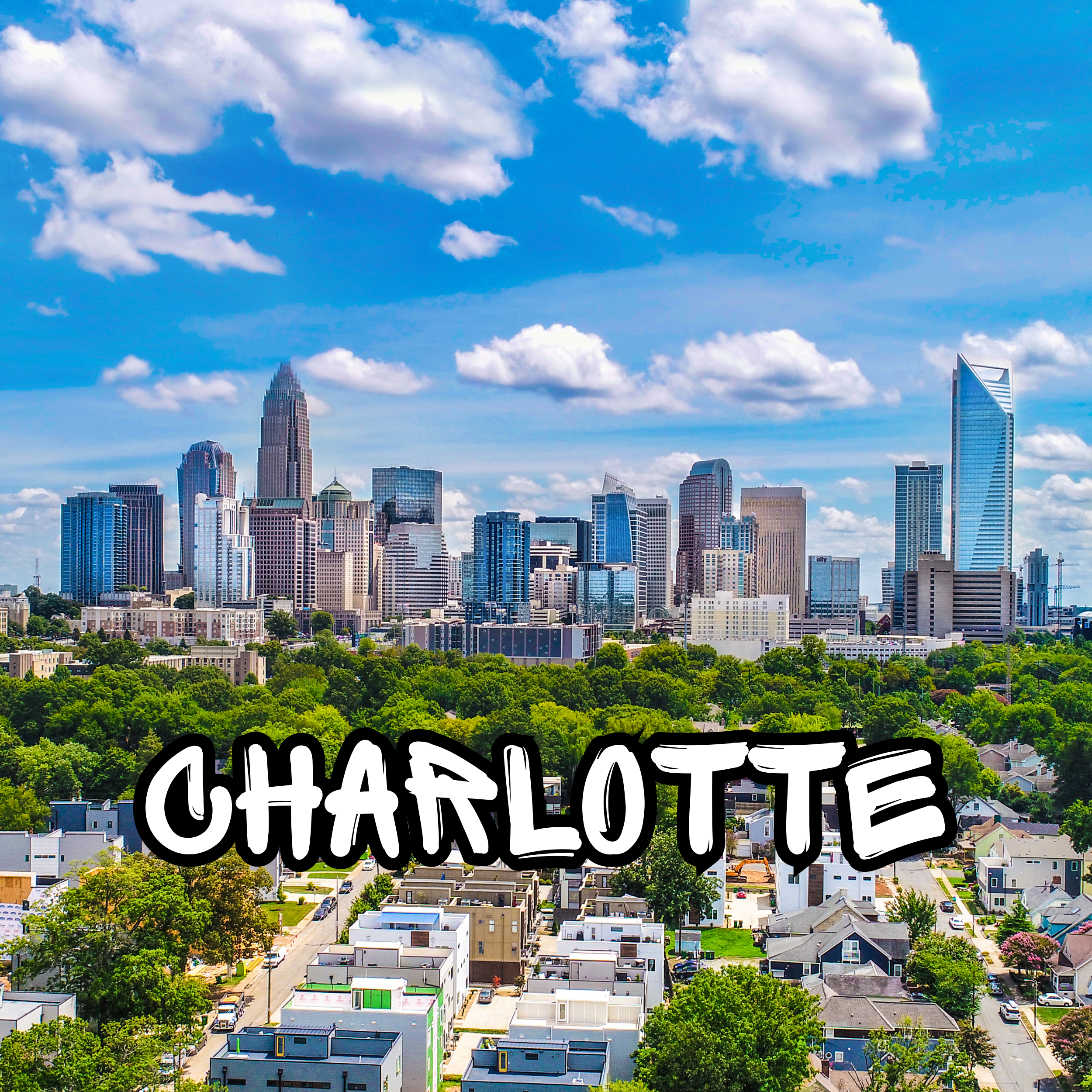 A city skyline with tall skyscrapers and a foreground of residential houses and green trees under a partly cloudy blue sky.