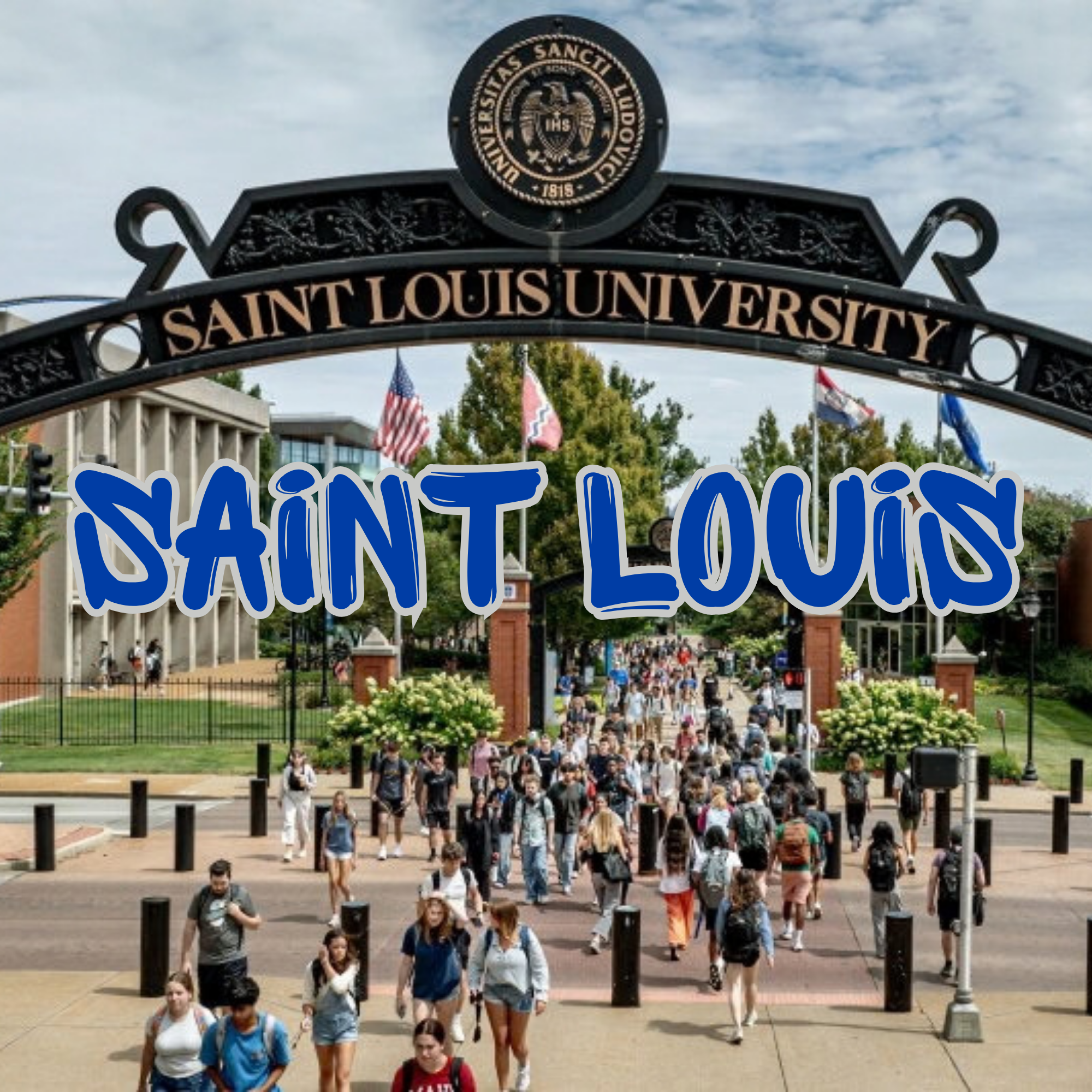 The entrance to Saint Louis University with a crowd of students walking in. There is an ornate black metal archway with the university's name and seal, and American flags are visible in the background.