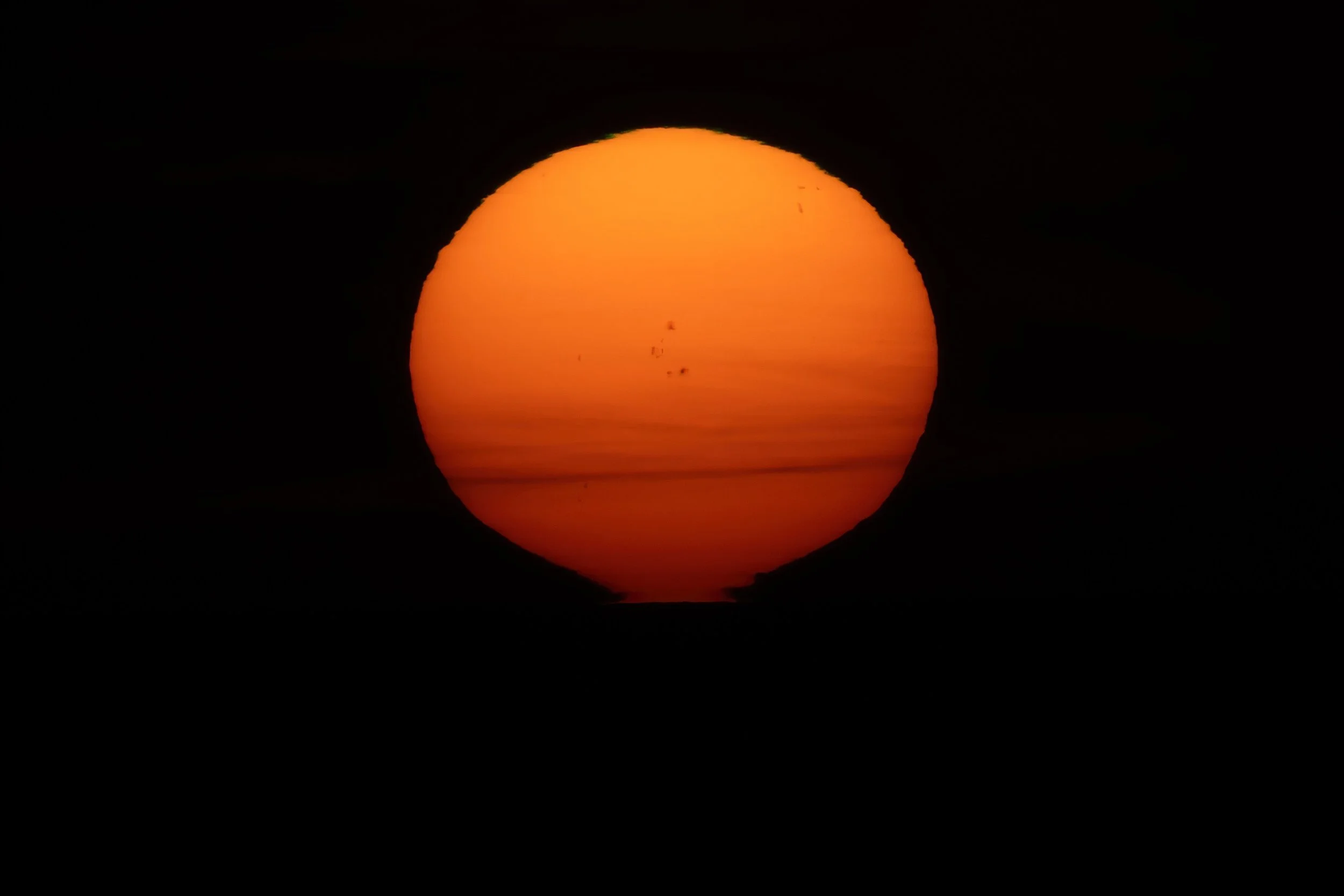 I love how the sun gets distorted towards the horizon at sea when its low. 