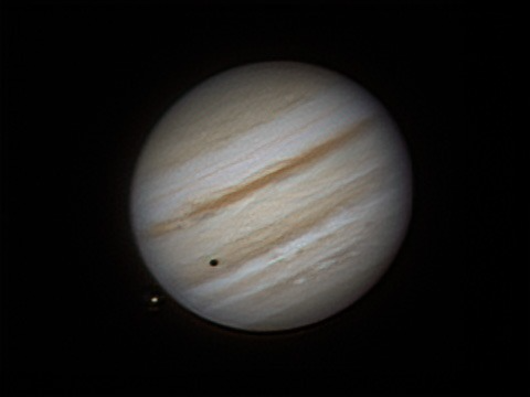 Jupiter with Io casting a shadow
