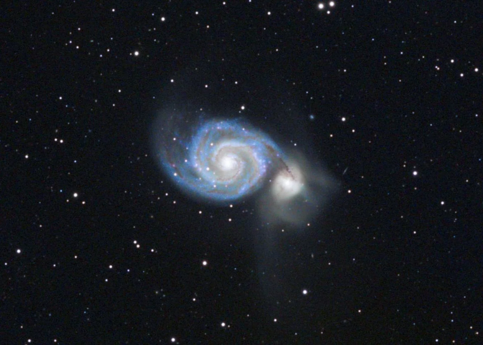 M51 The Whirlpool Galaxy in Canis Venatici. The blob on the tail at right is another galaxy that crashed through it around 60M years ago.