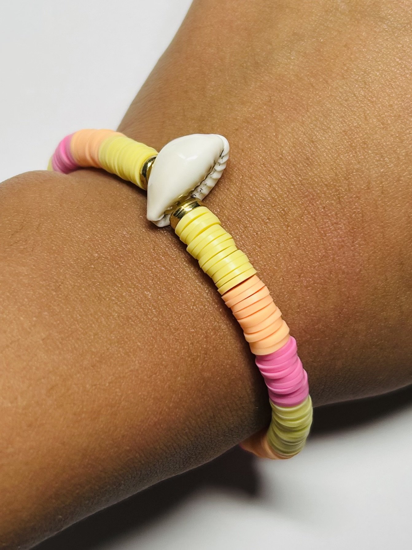 Sunset Handcrafted Jewelry Hand Shot.jpg