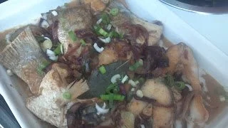 Bhetki Narkol Mach (Fish cooked in coconut milk)