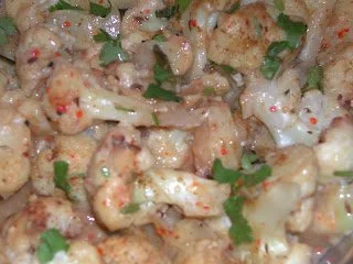 Cauliflower and mushroom roasted in coconut and cheese sauce