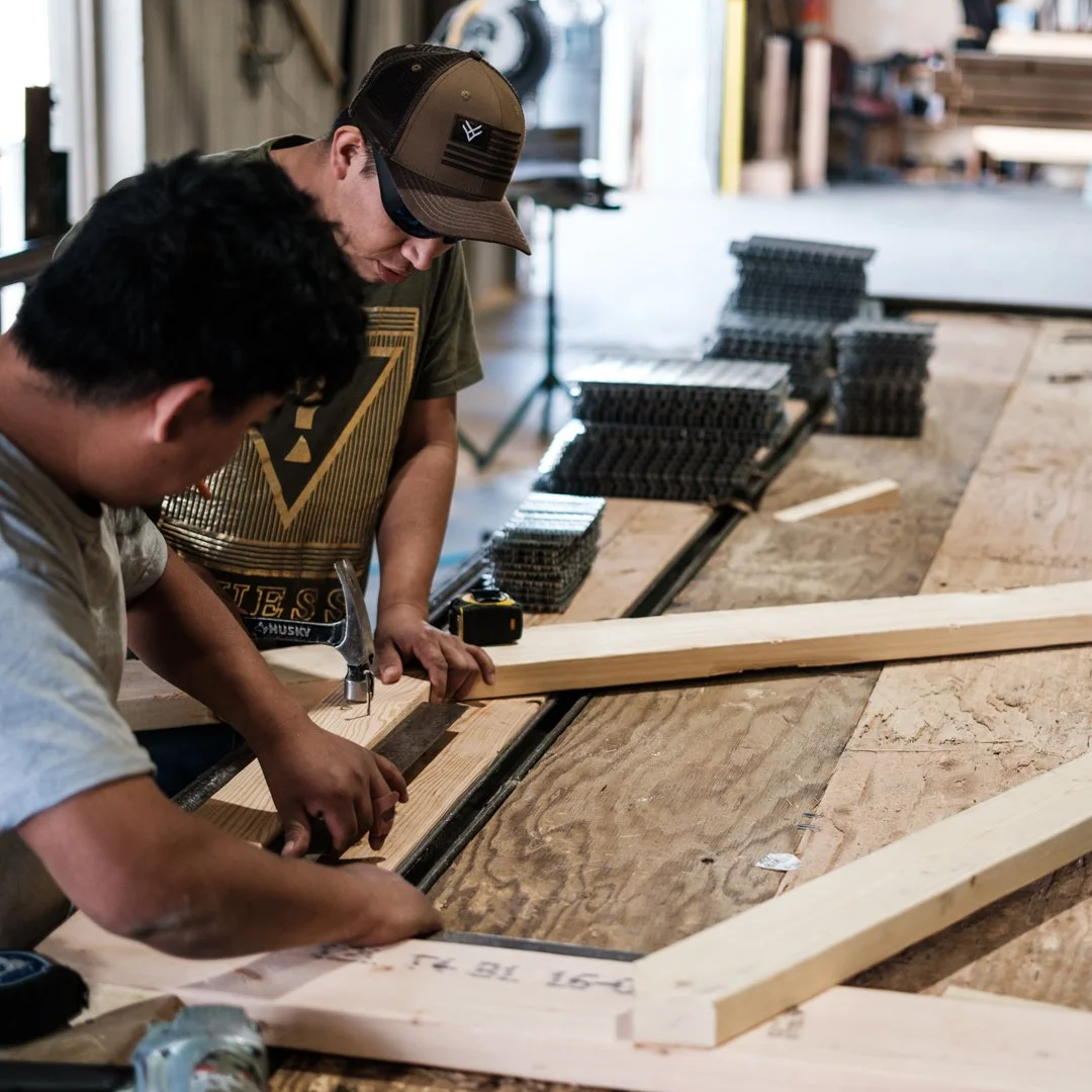 employees building roof trusses in Rigid Component Systems' Longmont Colorado plant