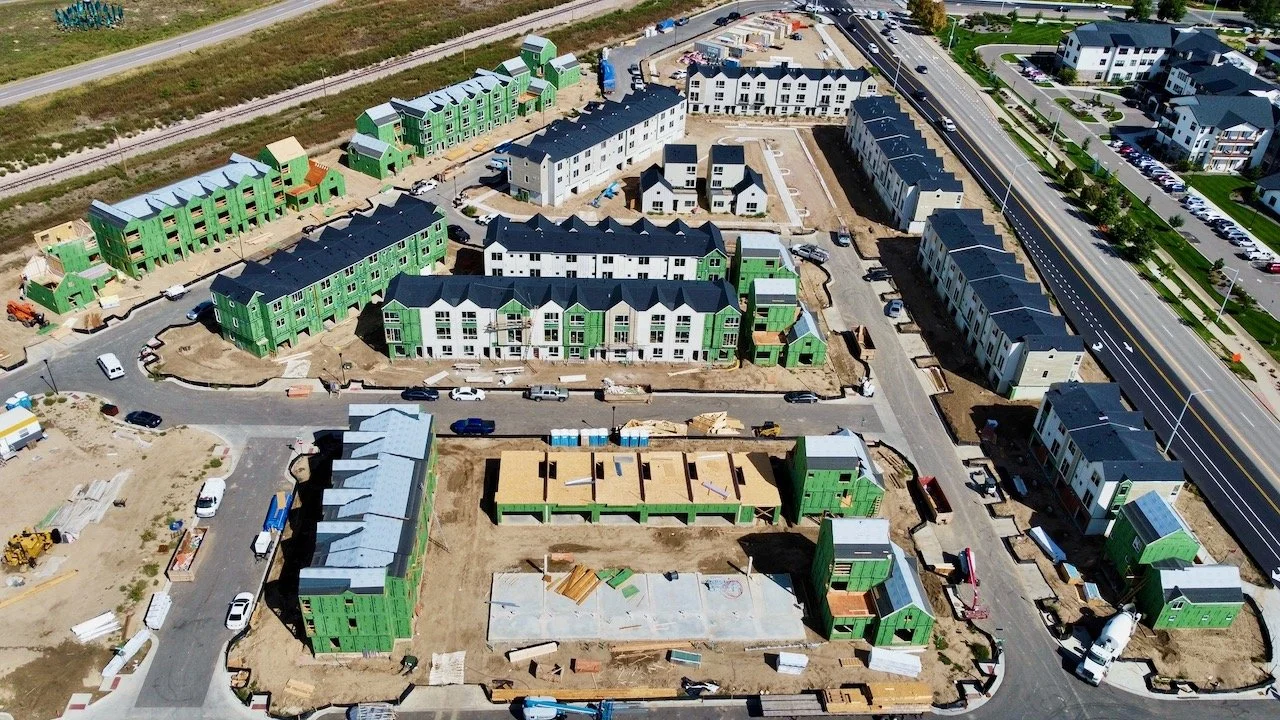 Drone view of a large build-for-rent townhome project in Longmont Colorado constructed with high-quality roof trusses
