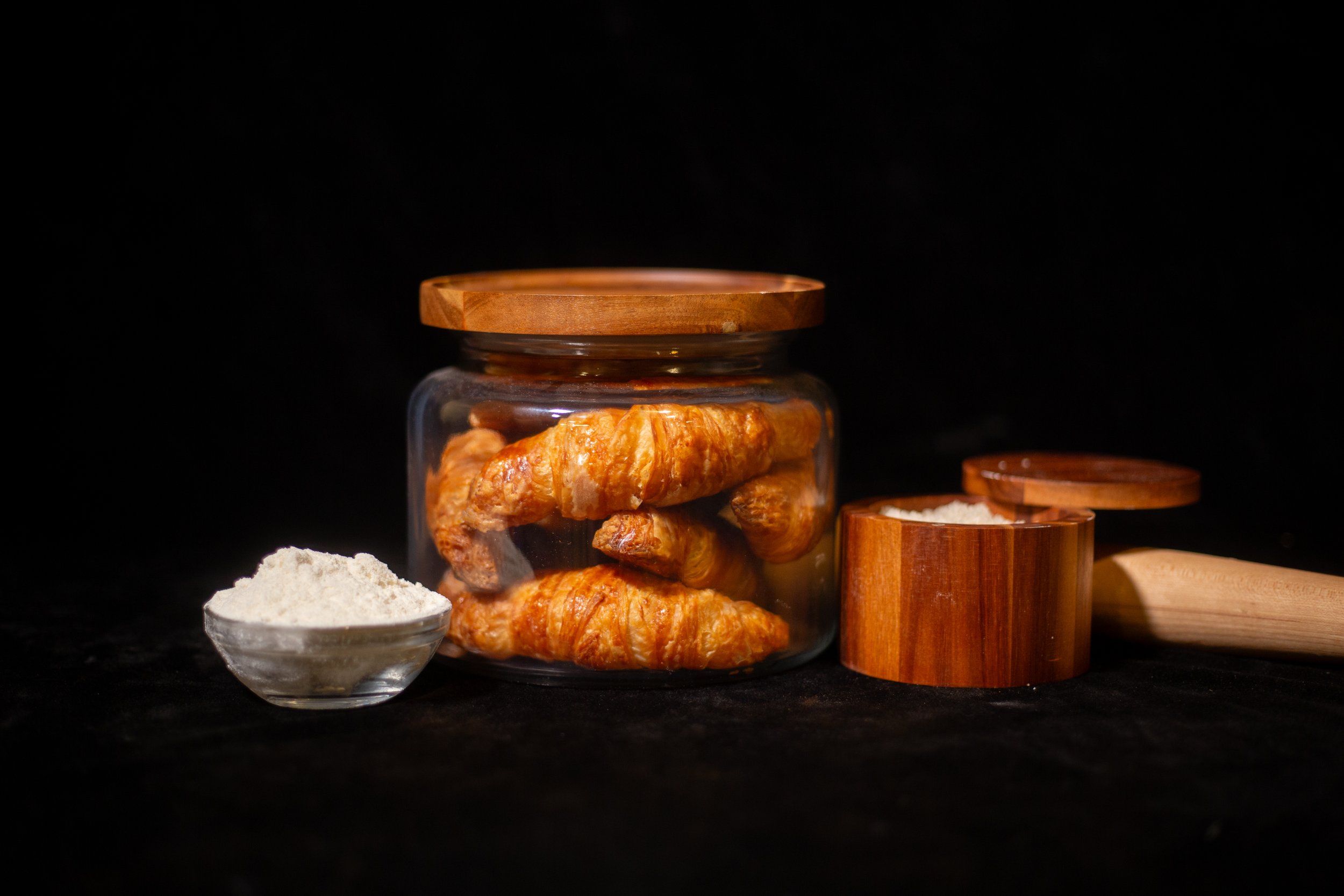 A tray of freshly baked jam-filled pastries, ready for wholesale.