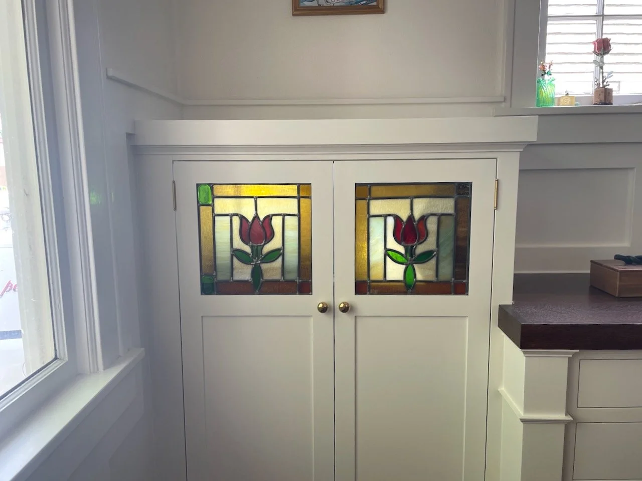 Stained glass tulip lit two panes.jpeg