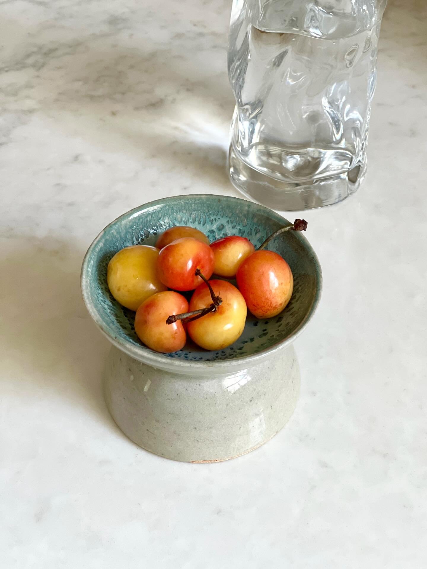 A tiny, two-sided snack bowl that holds 8 cherries by yours truly. 📷 by @jocelyn_lui
