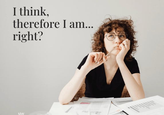 Brunette looking thoughfully with text above reading I think, therefore I am...right?