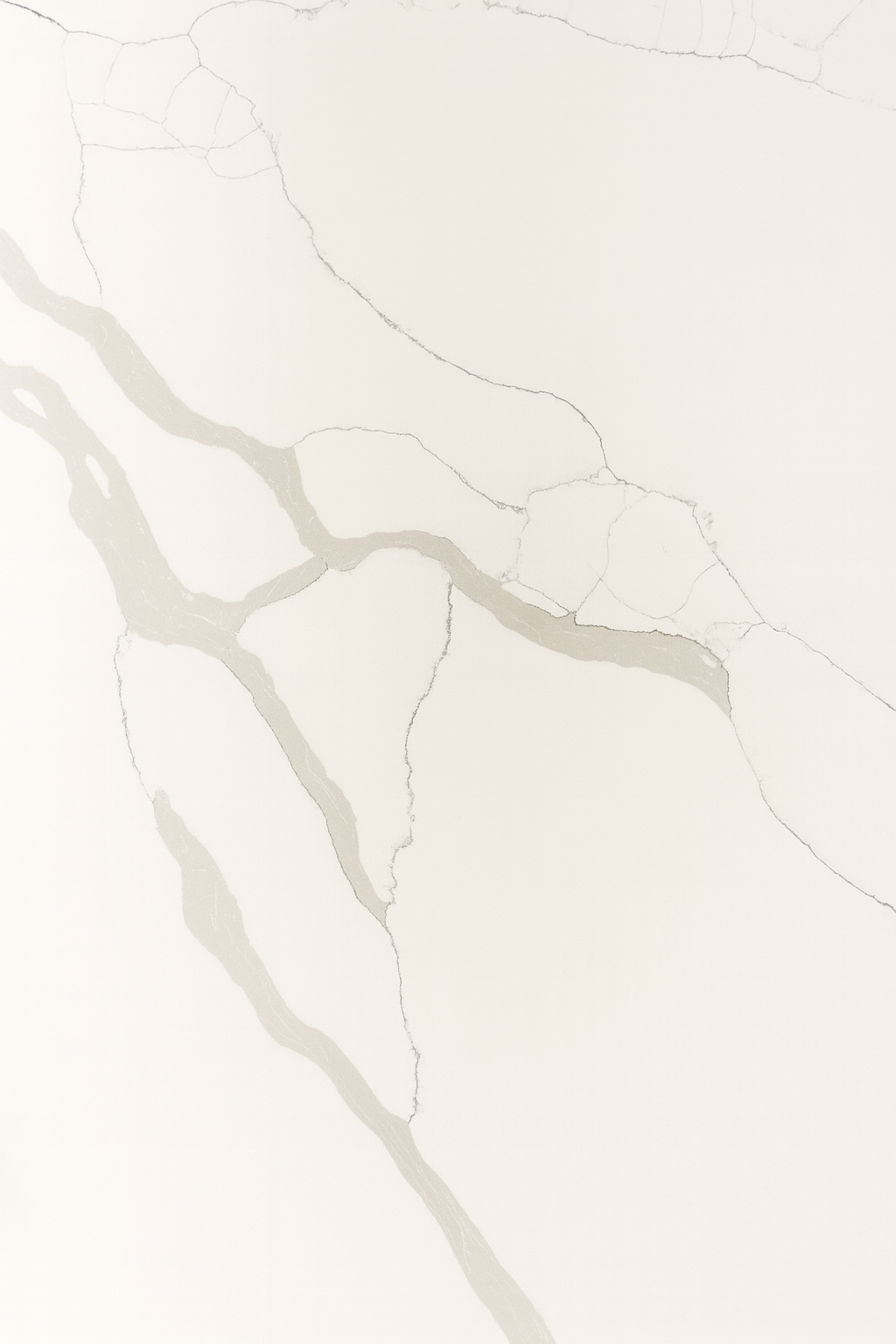 Close-up of a white marble surface with gray veining.