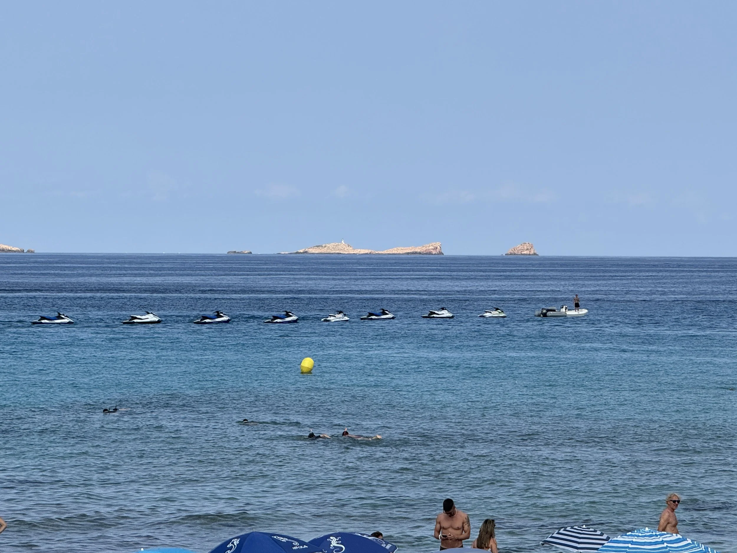 A line of jet ski's waiting to be rented.