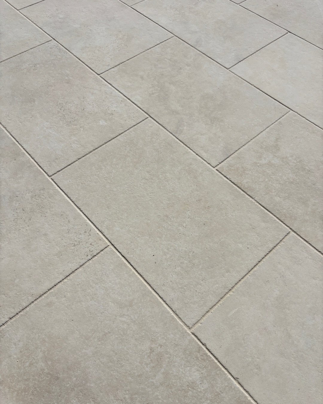 How we used it.

Using the same tile internally and externally is what makes this one work. 

The Jerusalem Stone Avorio has enough movement and texture to feel like natural stone, while still being consistent enough to run across large areas without