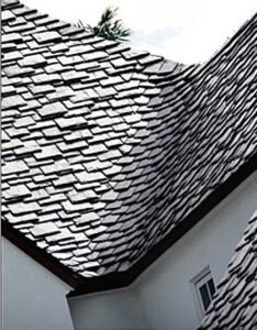 Staggered butt rolled slate roof valley installation
