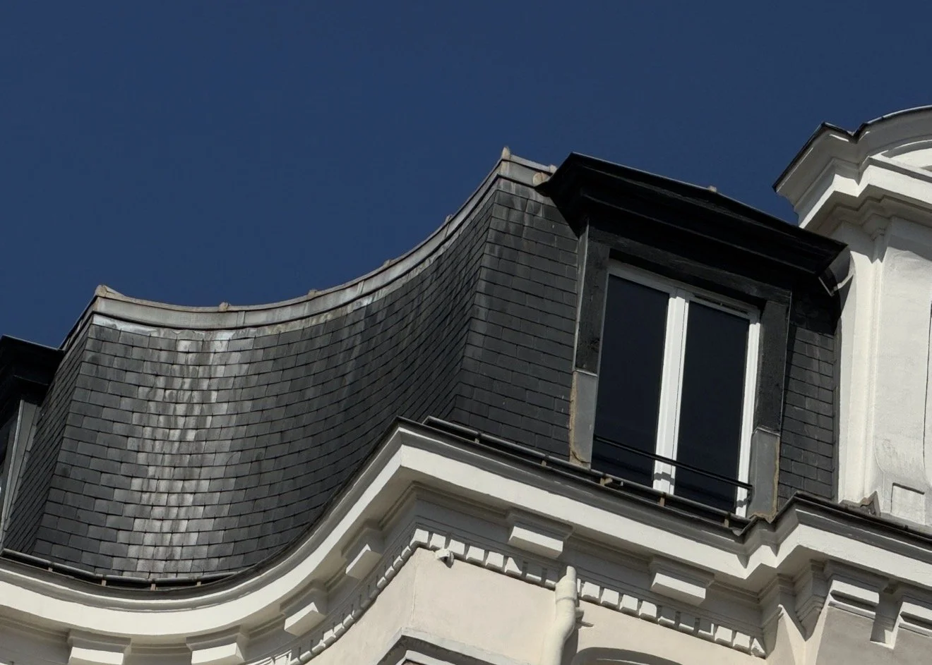 Curved slate with dormer detail