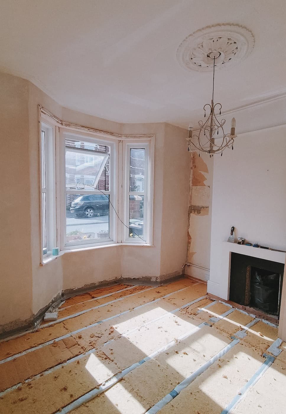 The floor being insulated before being covered in the house on Woodah Road in Exeter, Devon