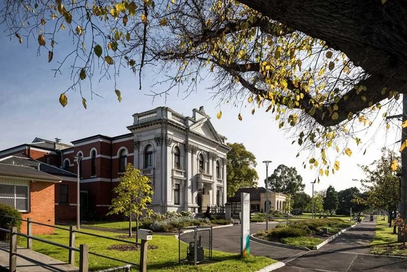 Photo of Kensington Town Hall in Melbourne with tree in the foreground