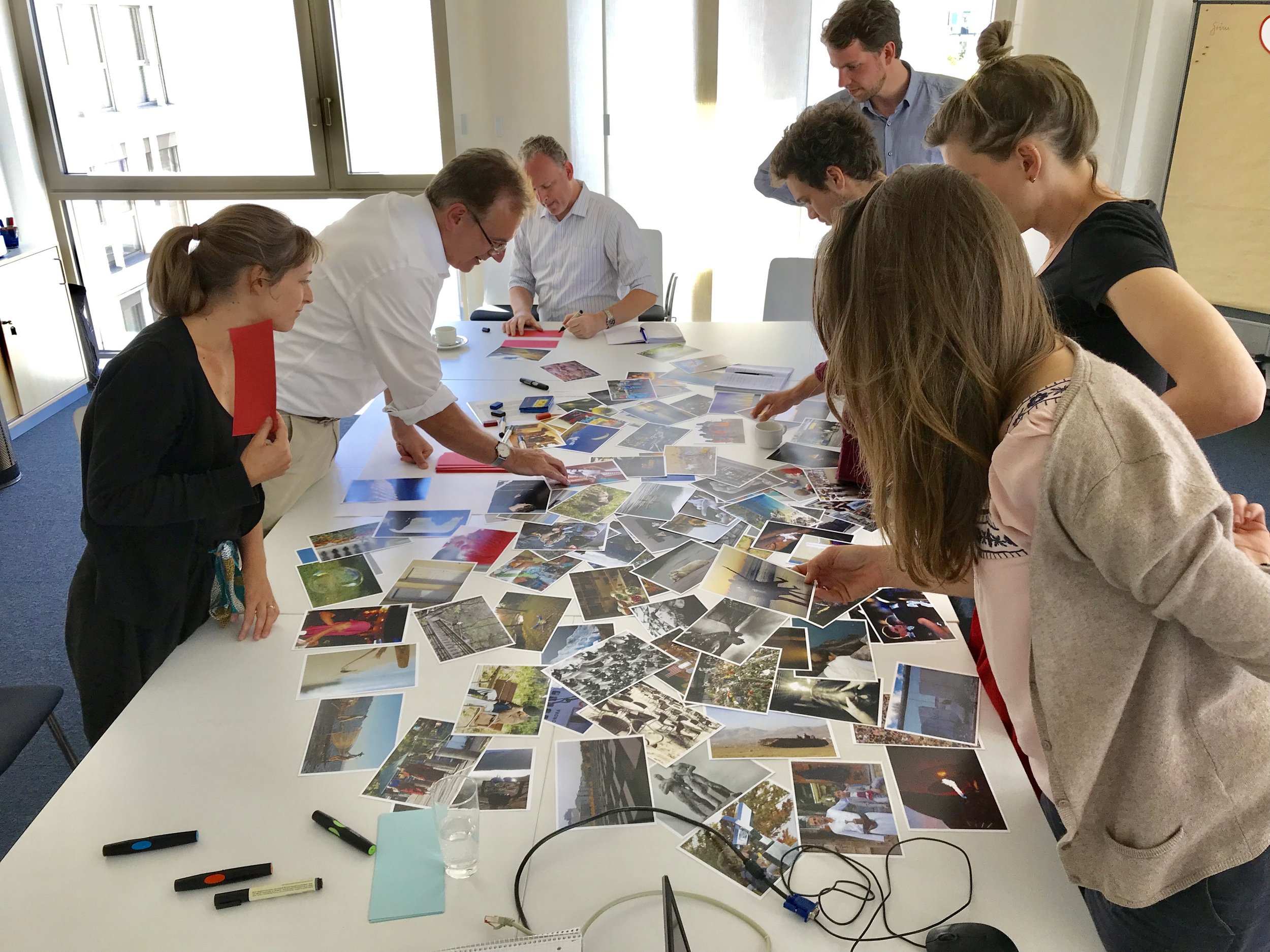 A small project team selects photos which represent their perceptions of the team - a great way to start a difficult conversation.