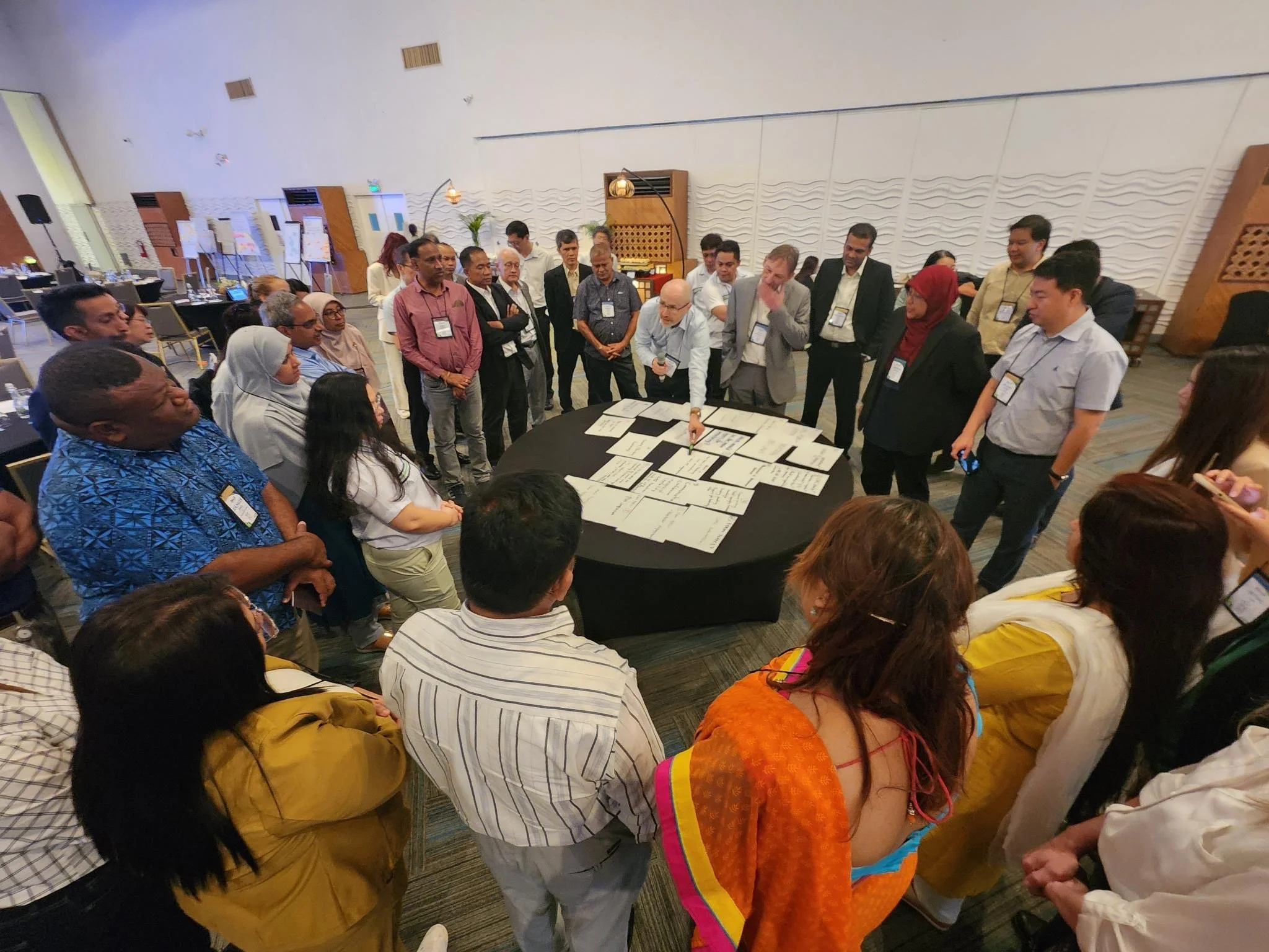 Stakeholders present group exercise results. I facilitate the conversation that drives alignment.