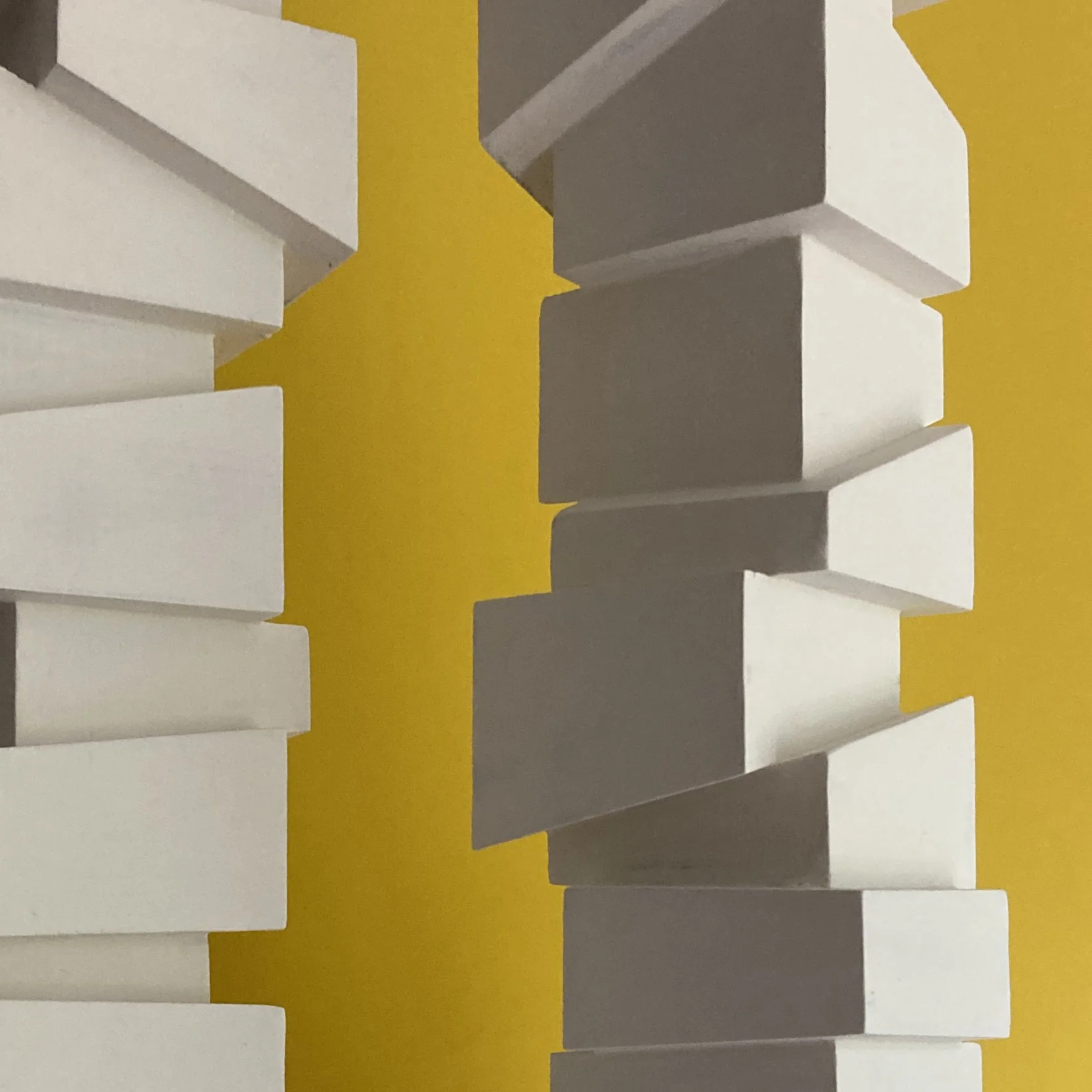 Slip Sculpture.  Vertical sculptures created by stacking cubes cut at angles.