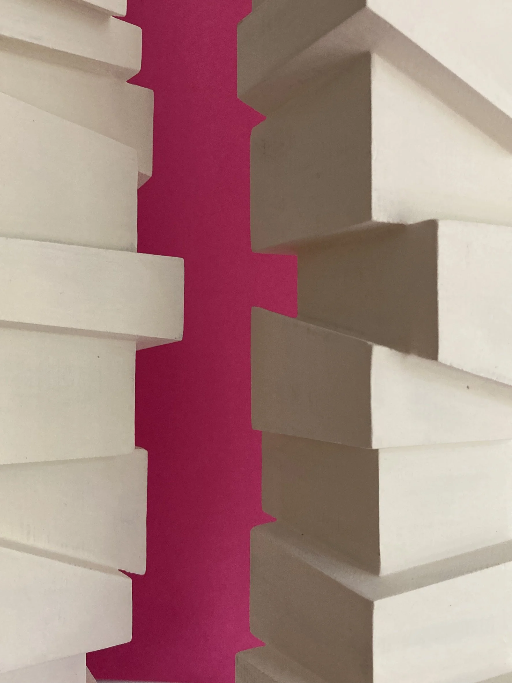 Slip Sculpture.  Vertical sculptures created by stacking cubes cut at angles.