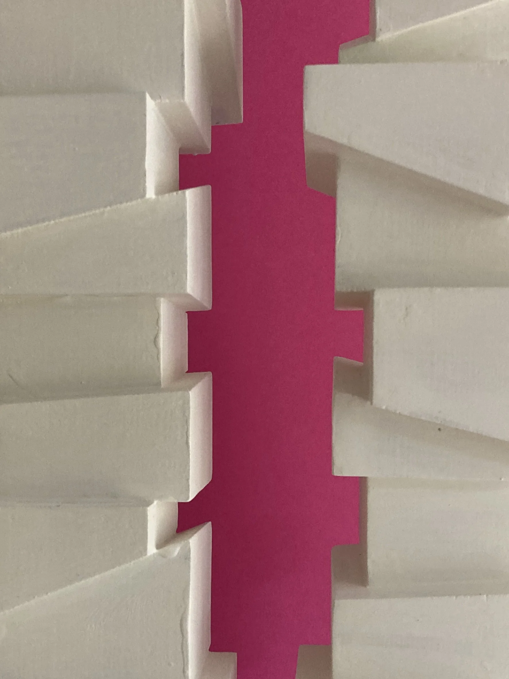 Slip Sculpture.  Vertical sculptures created by stacking cubes cut at angles.