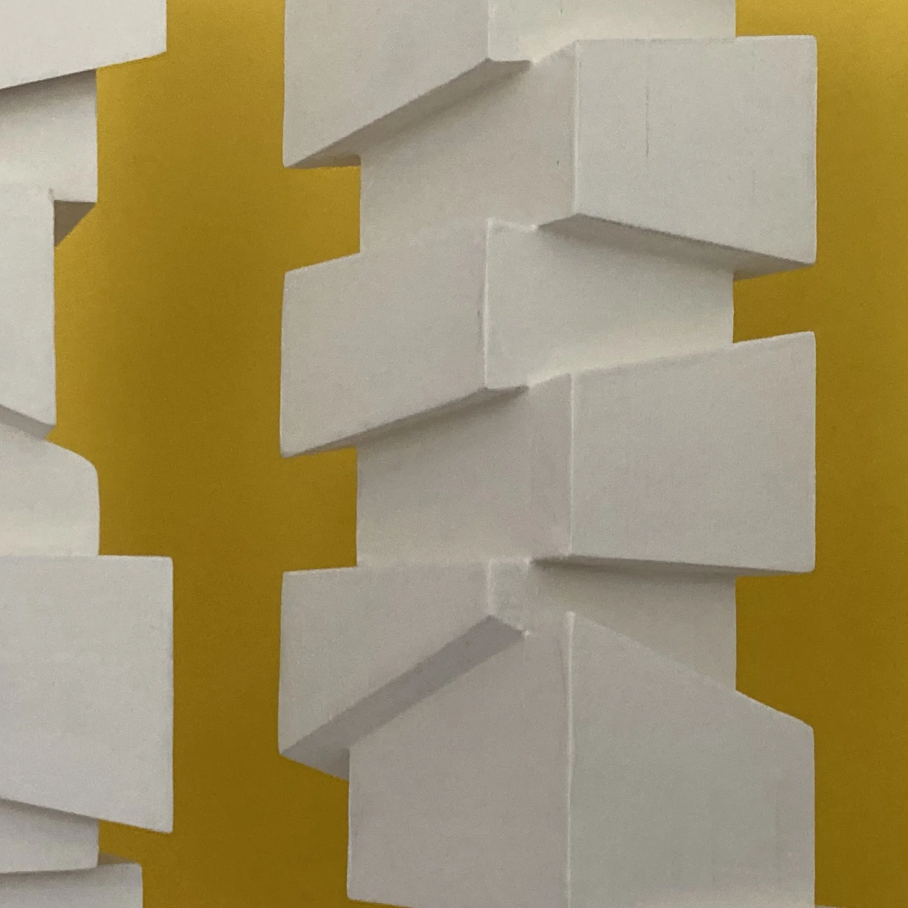 Slip Sculpture.  Vertical sculptures created by stacking cubes cut at angles.