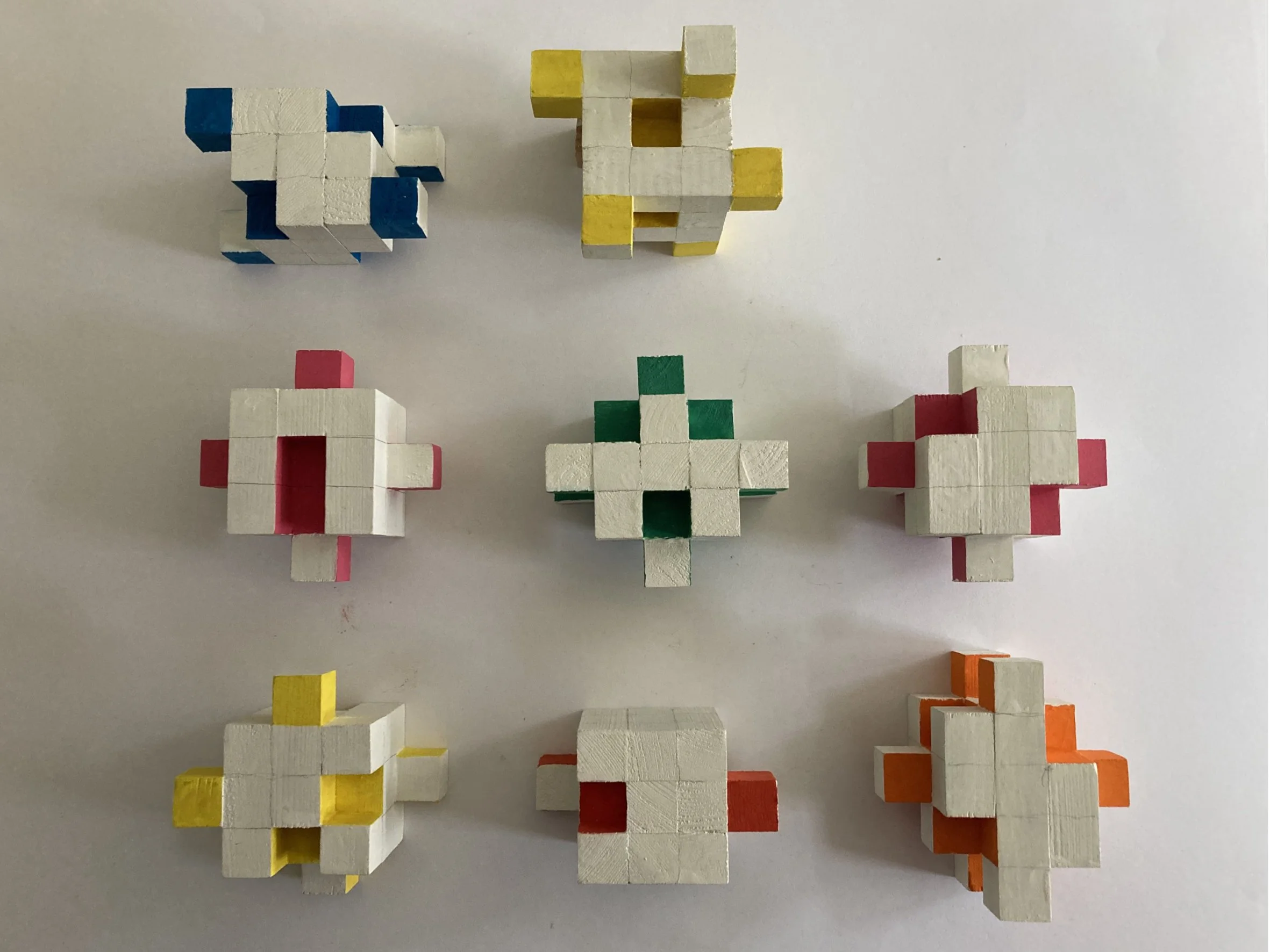 Shift Sculpture.  A group of small sculptures created by rearranging cubes.