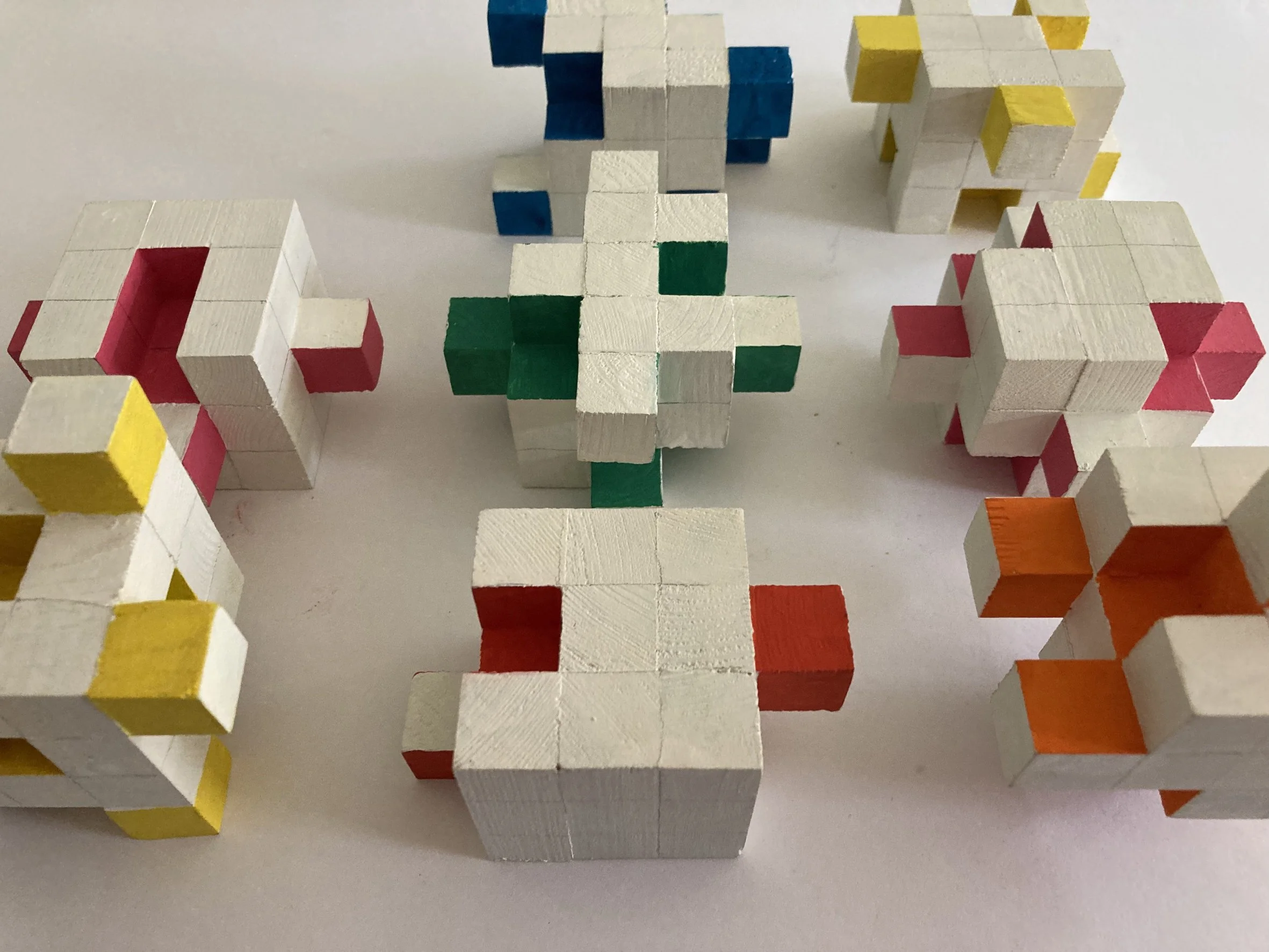 Shift Sculpture.  A group of small sculptures created by rearranging cubes.