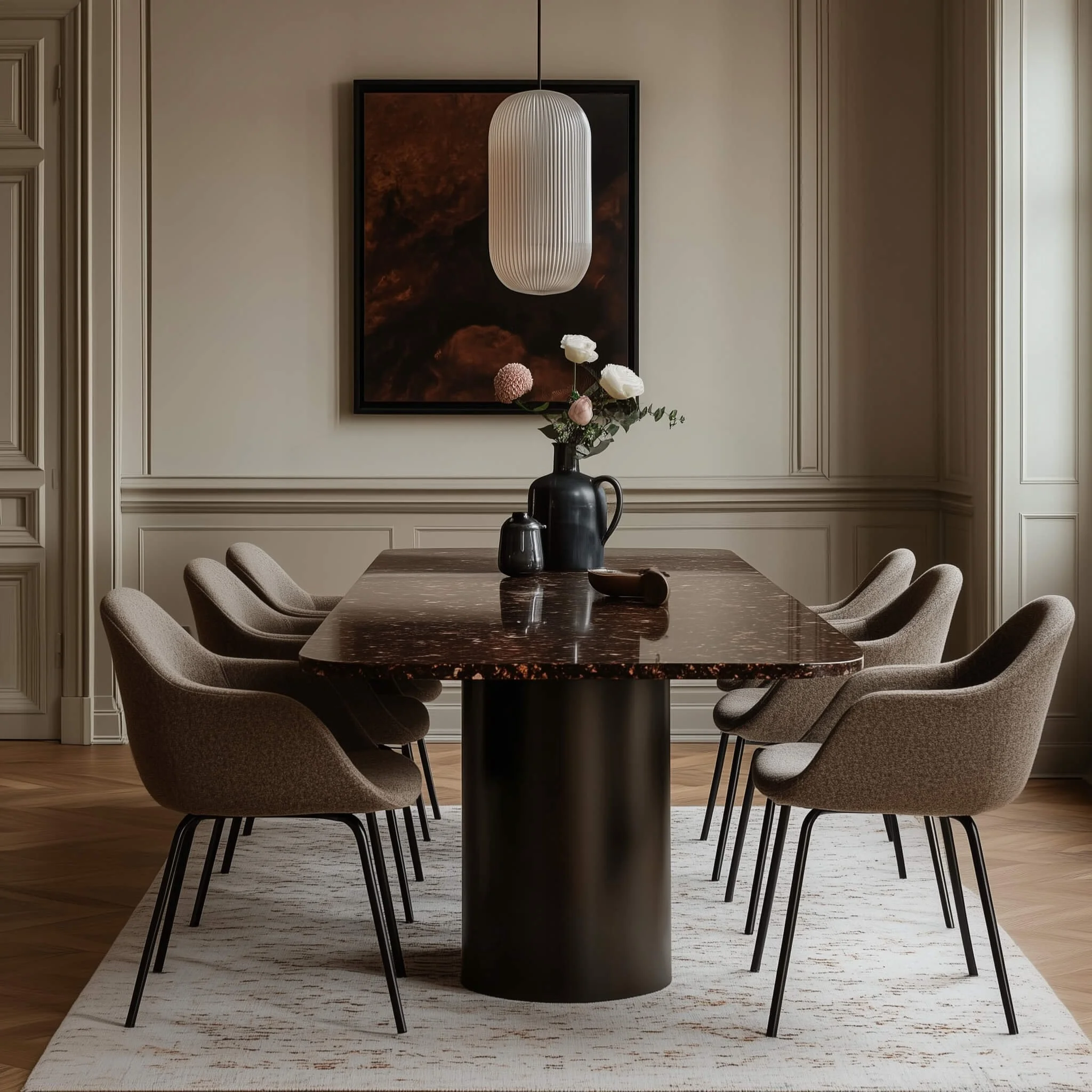 Athens dining room by Studio Andriotis with dark marble dining table, taupe upholstered chairs, and minimalist pendant light.