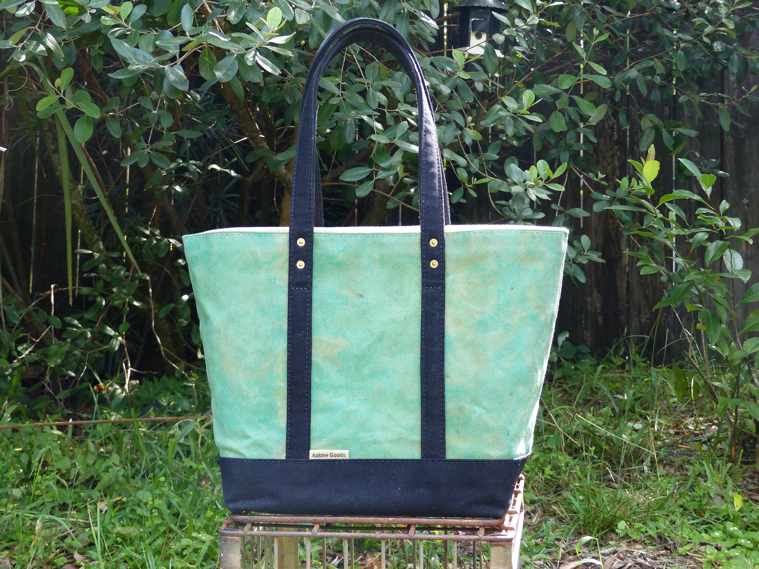 Copper tarnish printed with black straps and base.