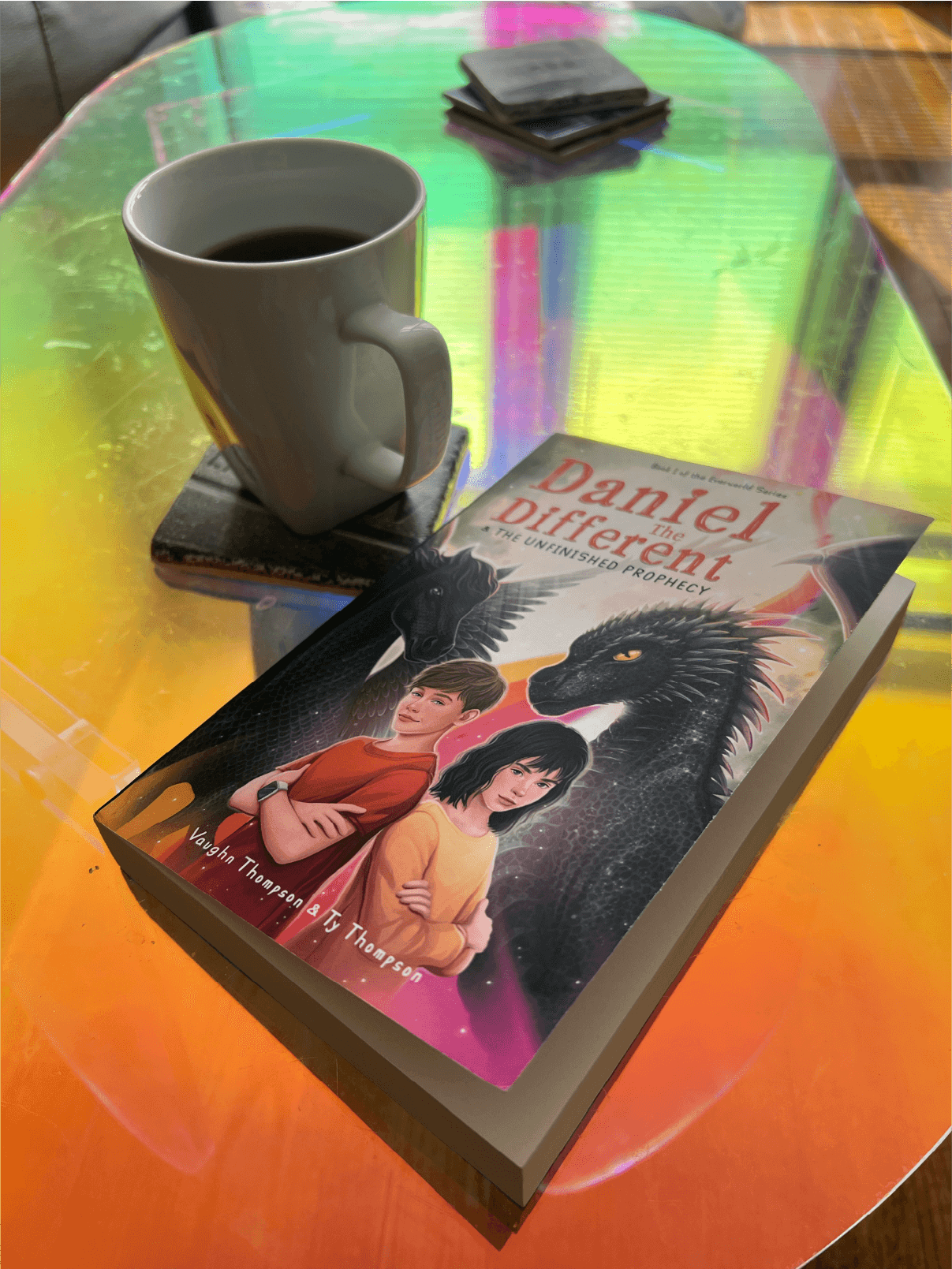 Photo of Daniel the Different book on rainbow coffee table next to coffee