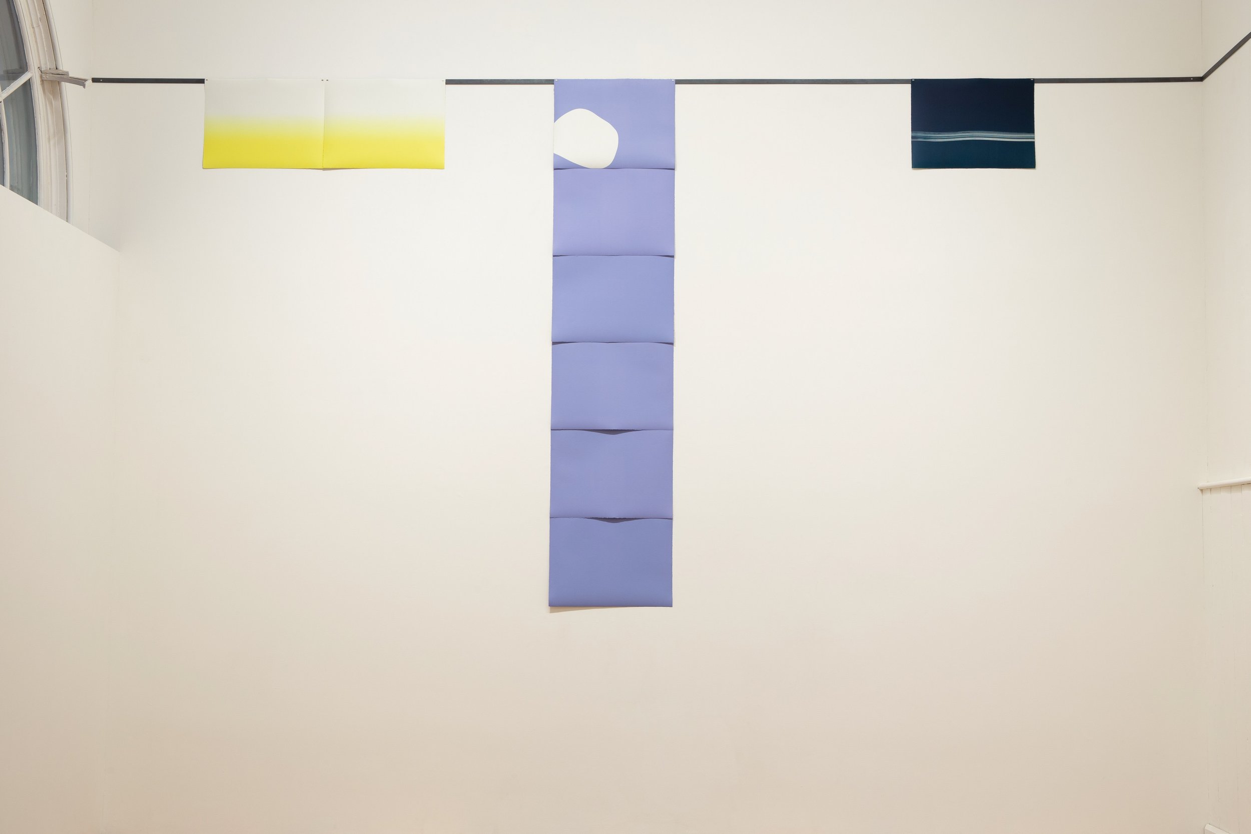 Column (pale lilac), 2023, hand printed etching ink on Zerkall paper, steel bars, magnets, 288x64cm (dimensions variable)