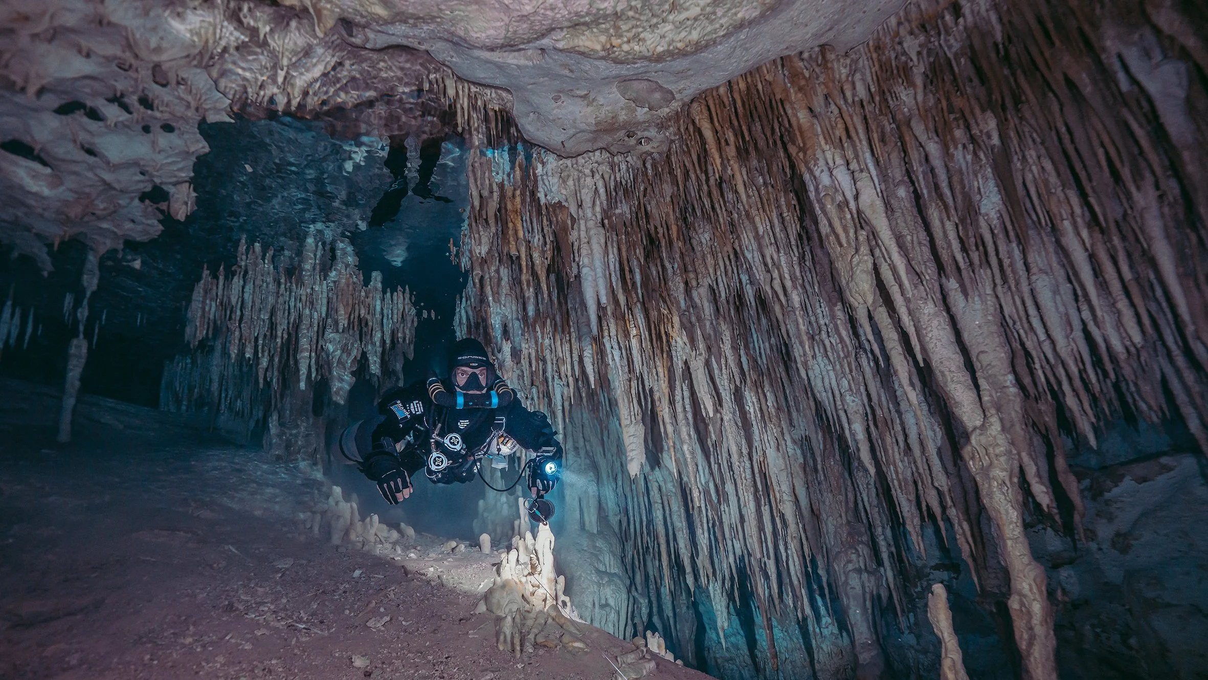 Cave diving through tulum cenotes