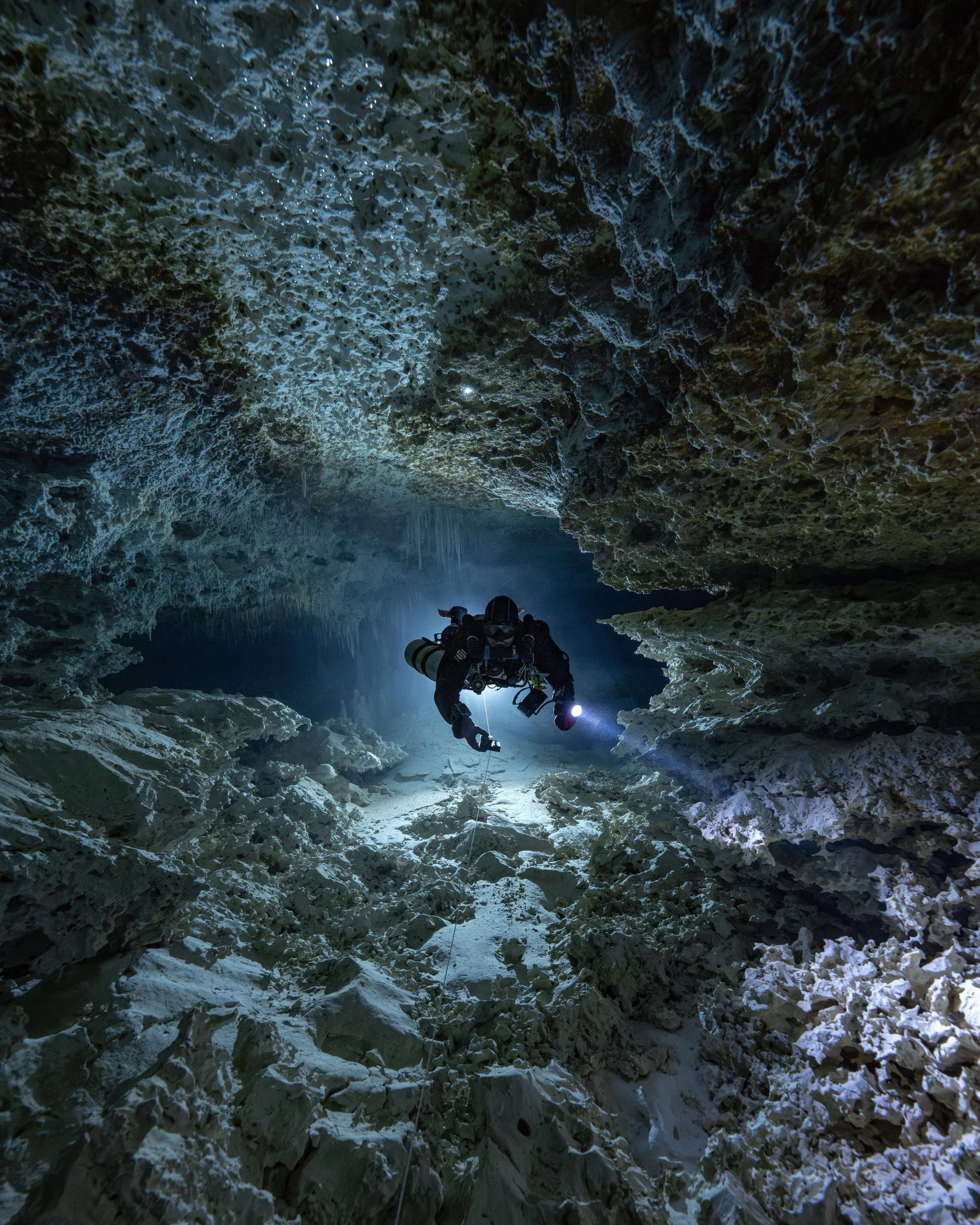 Skanda Coffield-Feith surveying a newly laid cave line.
