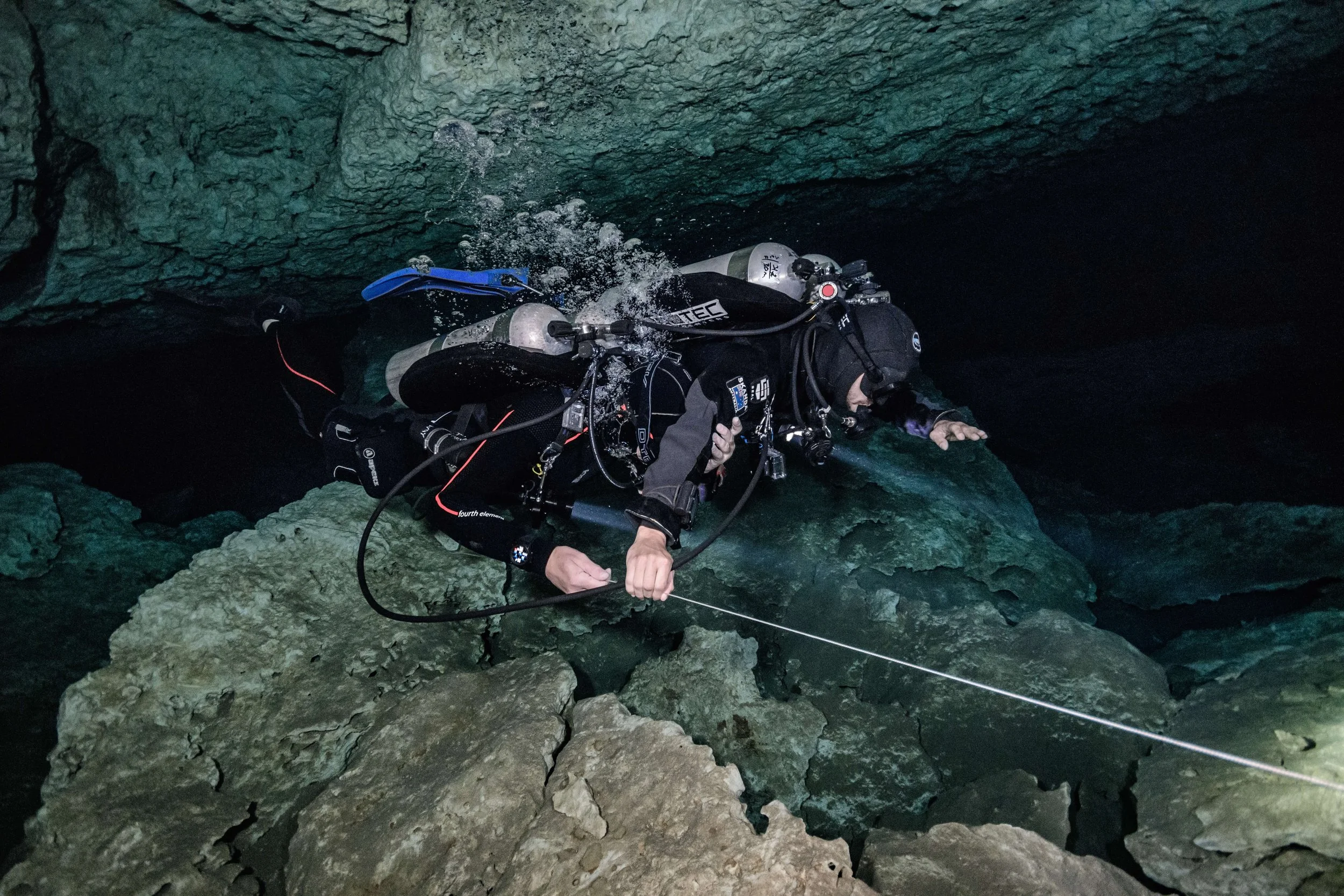 Skanda Coffield-Feith practicing zero visibility exits during cave diver training