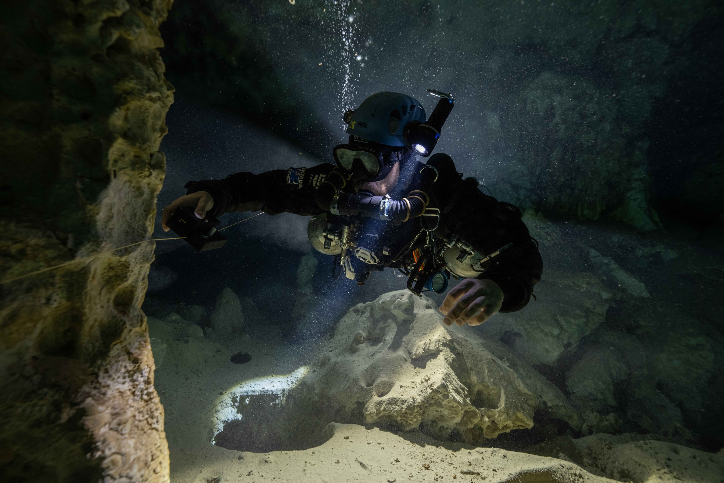 Skanda Coffield-Feith surveying cave lines with the Mnemo survey tool