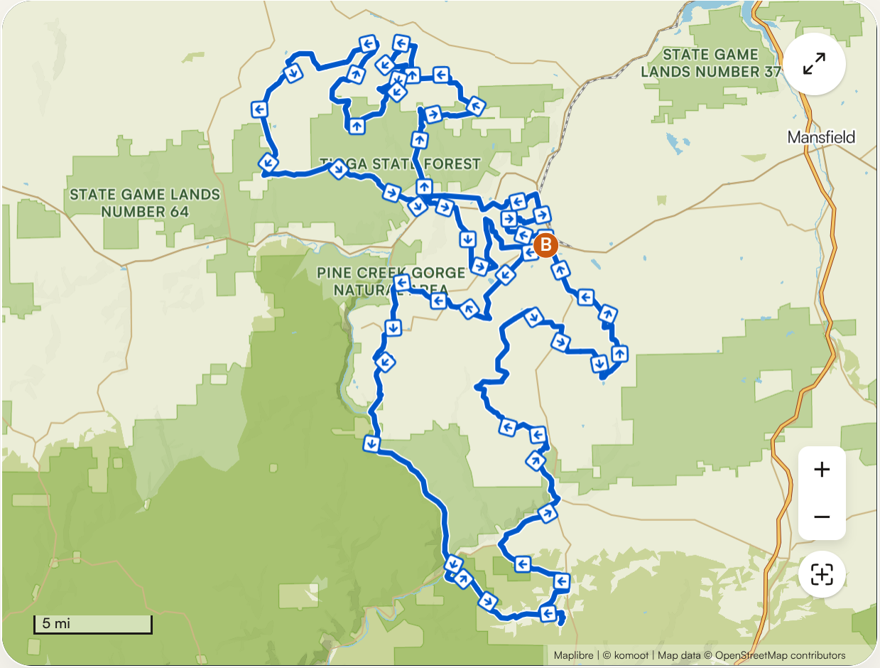 A map showing a trail route through Pine Creek Gorge Natural Area and surrounding state game lands, with multiple trail markers and directional arrows.